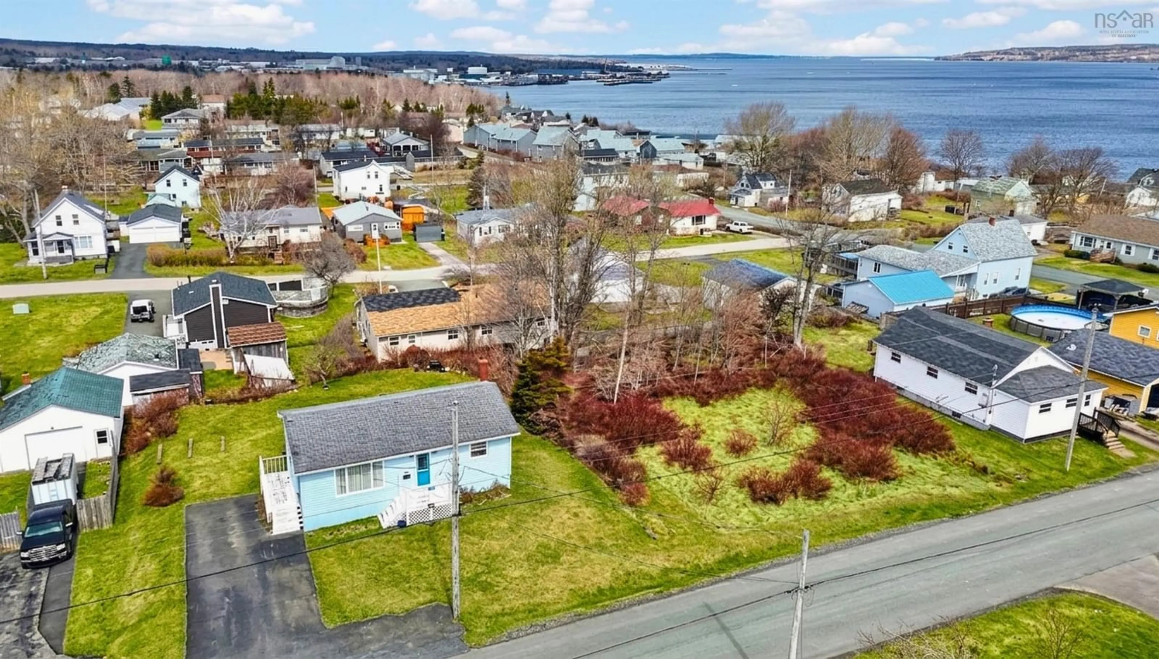 A pic from outside/outdoor area/front of a property/back of a property/a pic from drone, water/lake/river/ocean view for 62 Monteith Ave, Westmount Nova Scotia B1R 1K6