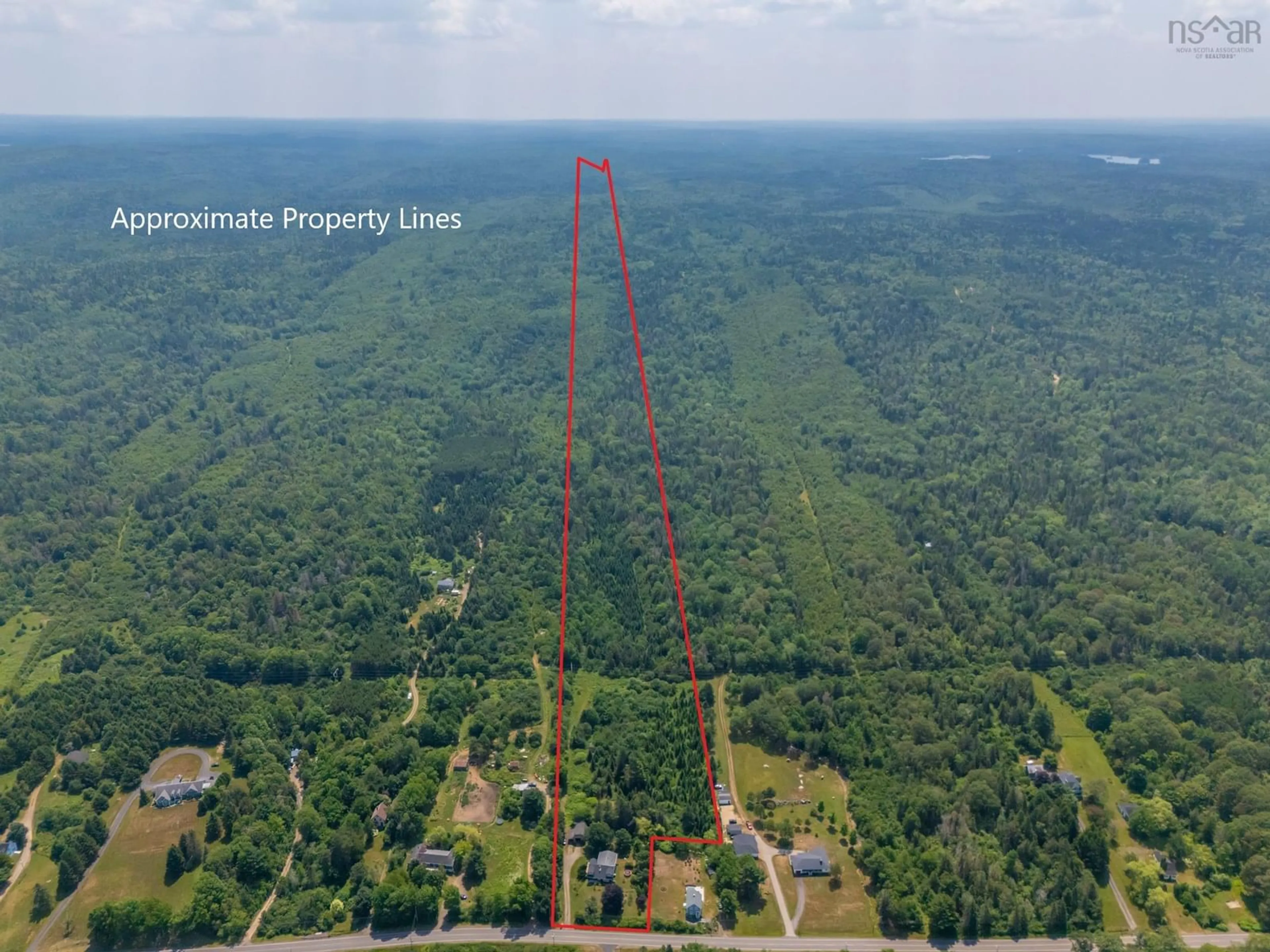 A pic from outside/outdoor area/front of a property/back of a property/a pic from drone, forest/trees view for 1242 Highway 201, Round Hill Nova Scotia B0S 1A0
