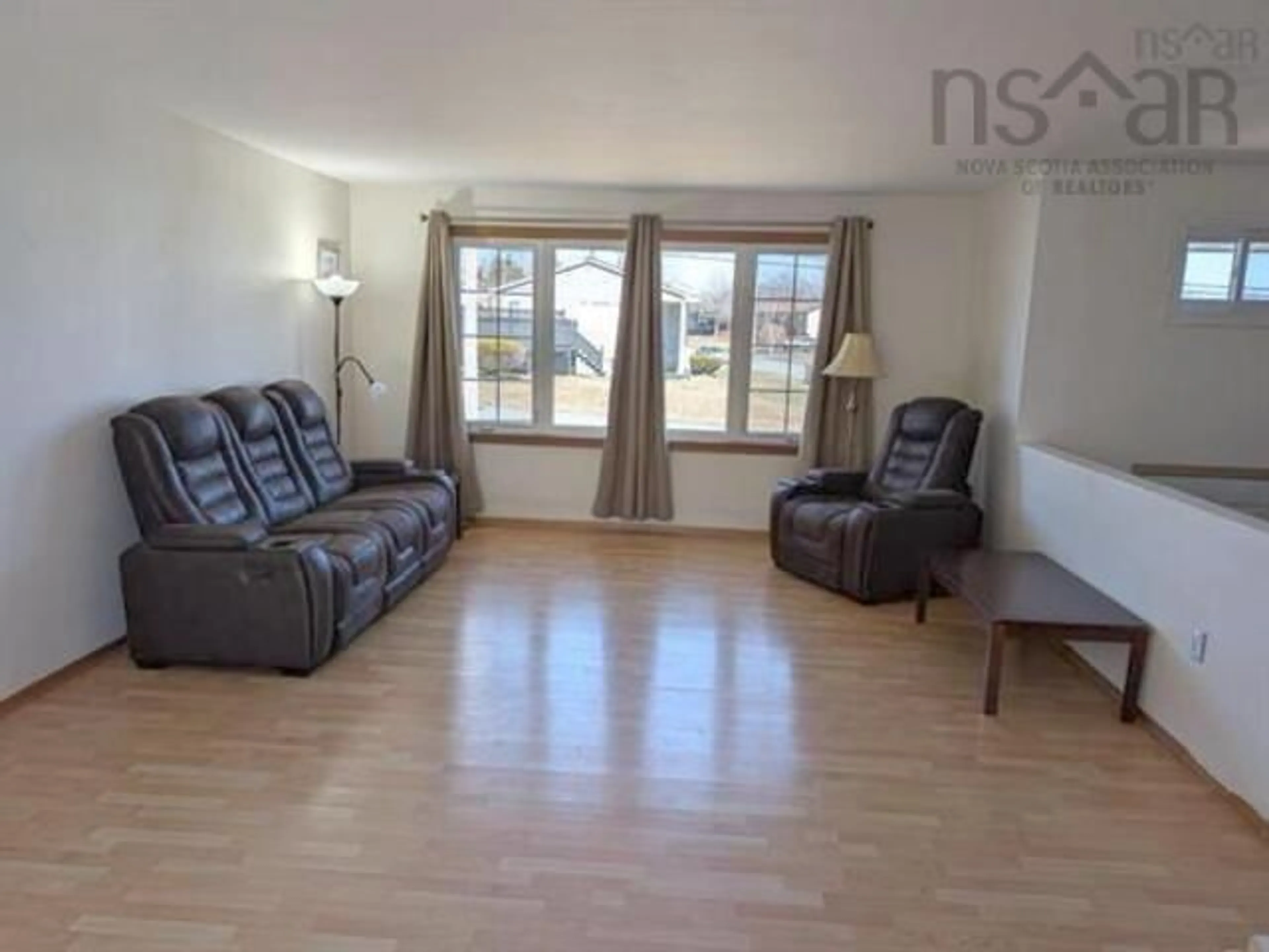 Living room with furniture, wood/laminate floor for 57 Carlisle Dr, Dartmouth Nova Scotia B2V 1V8