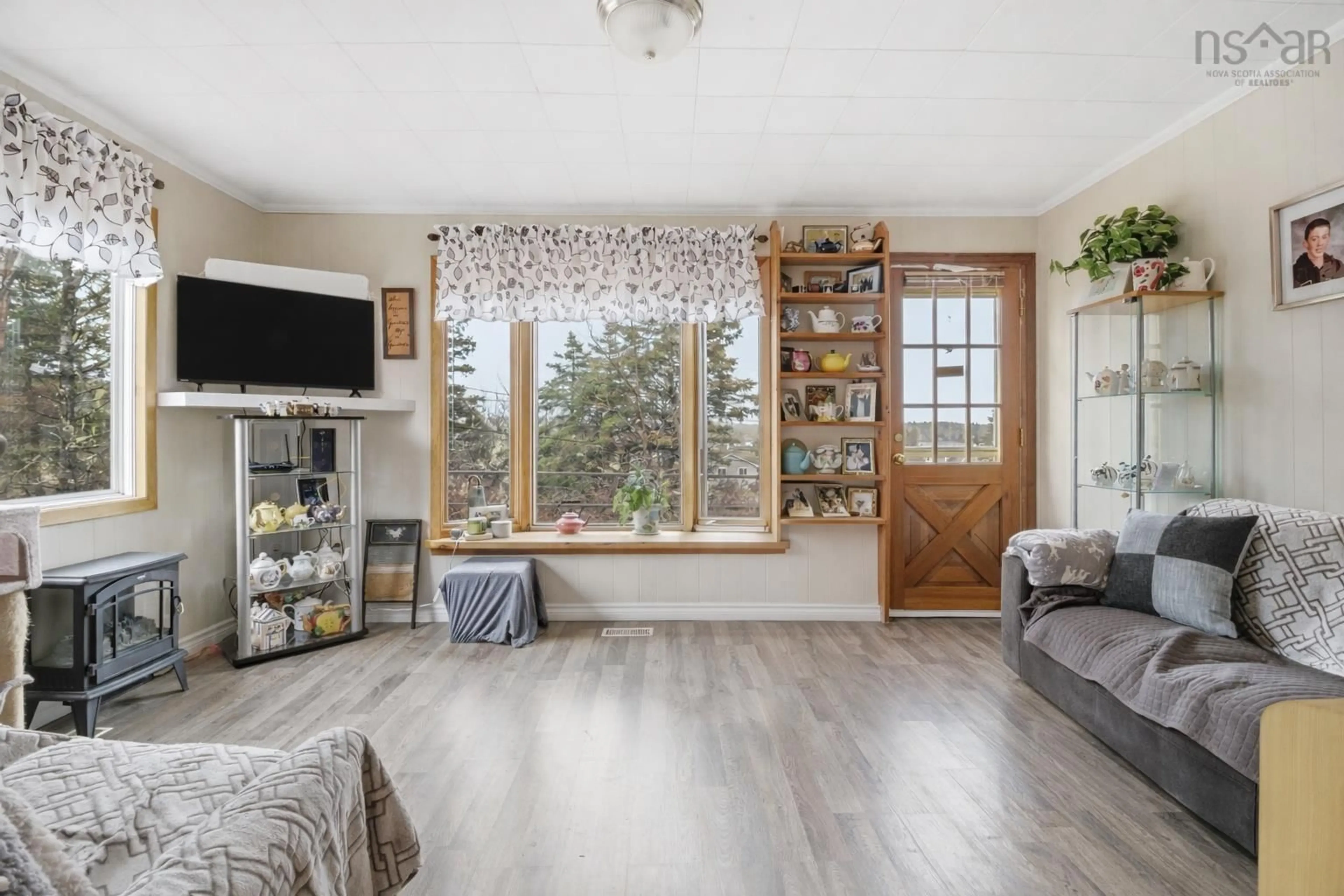 Living room with furniture, wood/laminate floor for 135 Redmonds Rd, Seabright Nova Scotia B3Z 3C3