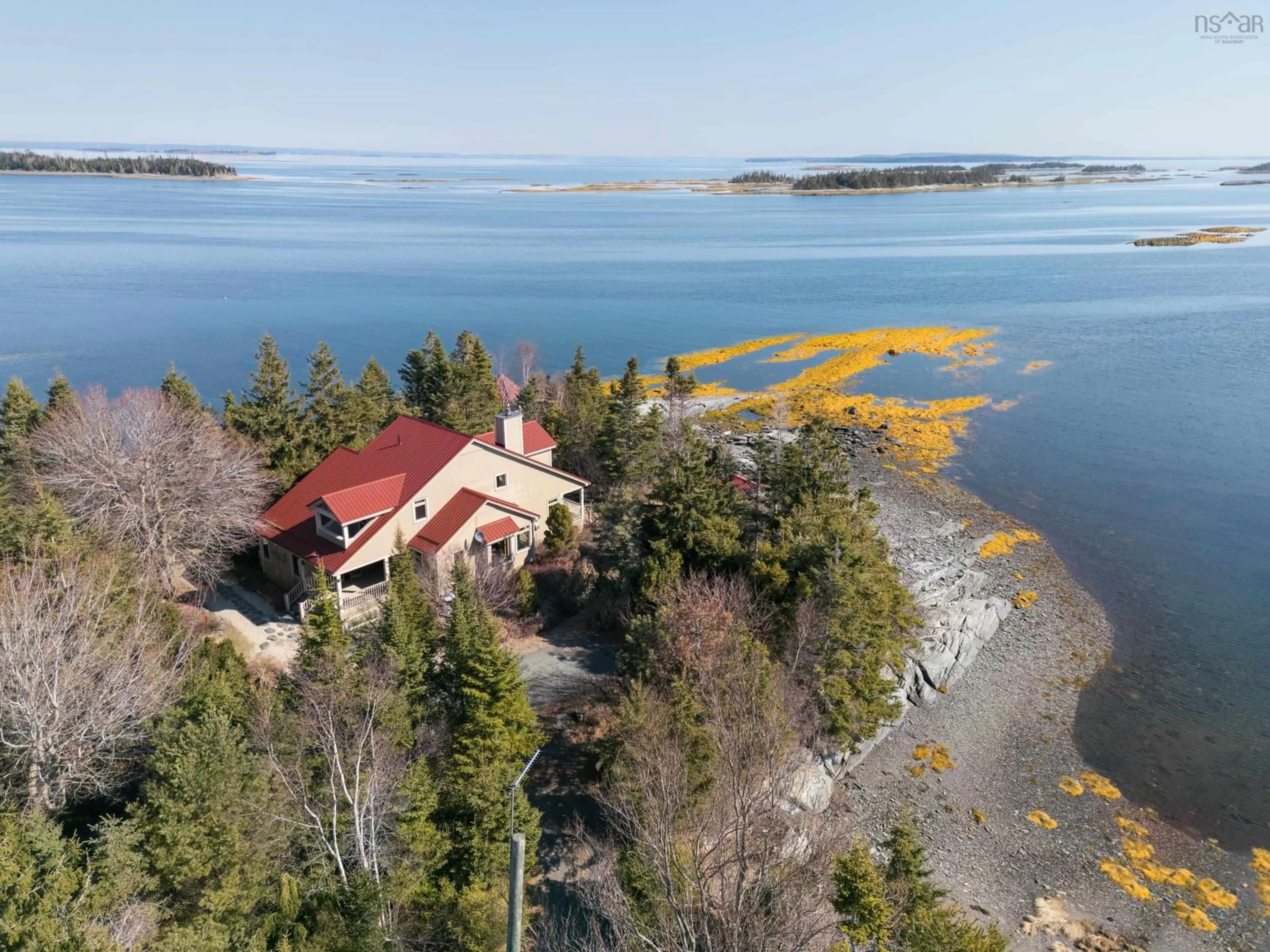 A pic from outside/outdoor area/front of a property/back of a property/a pic from drone, water/lake/river/ocean view for 181 Pine Dr, Heckmans Island Nova Scotia B0J 2C0
