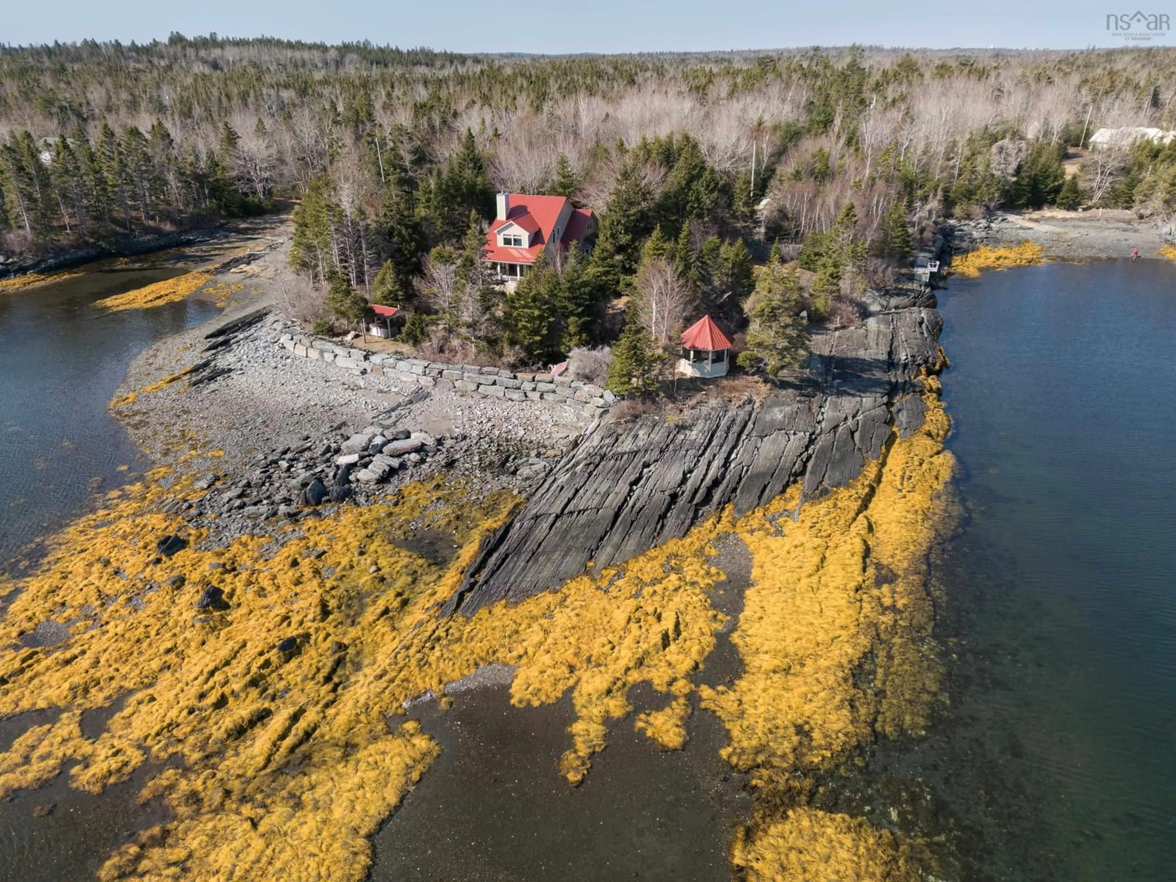 A pic from outside/outdoor area/front of a property/back of a property/a pic from drone, water/lake/river/ocean view for 181 Pine Dr, Heckmans Island Nova Scotia B0J 2C0