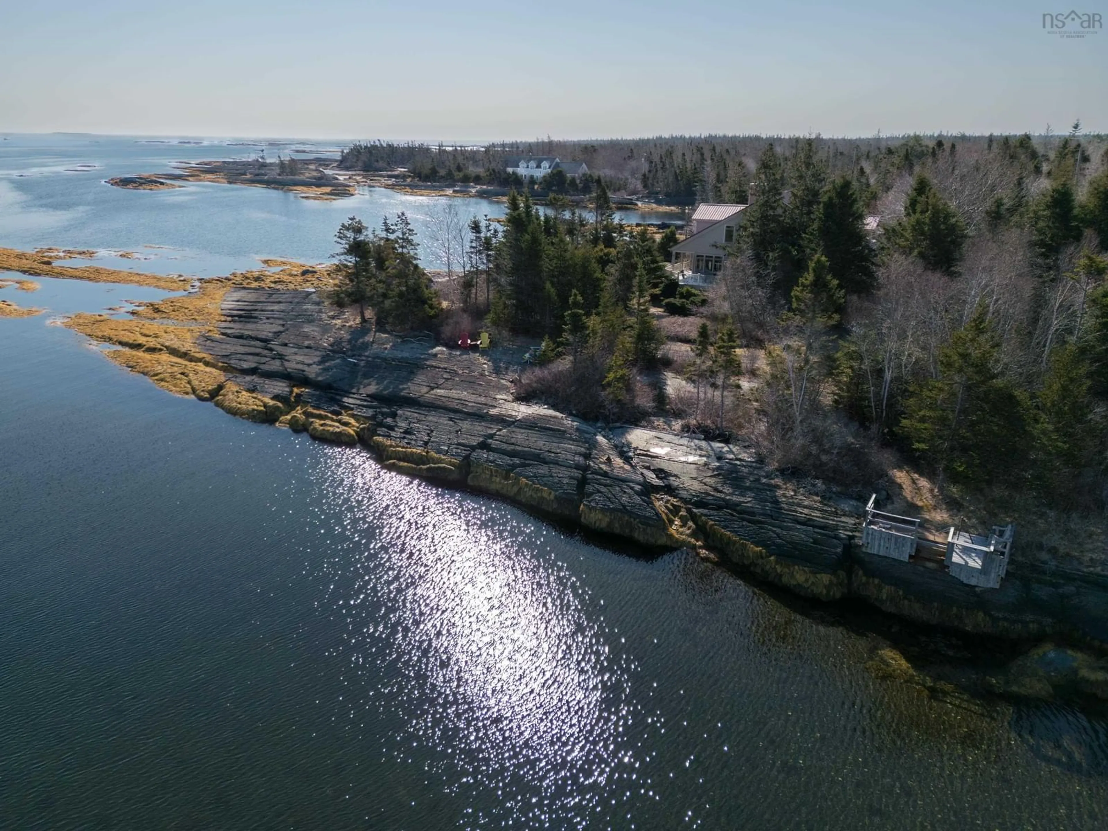 A pic from outside/outdoor area/front of a property/back of a property/a pic from drone, water/lake/river/ocean view for 181 Pine Dr, Heckmans Island Nova Scotia B0J 2C0