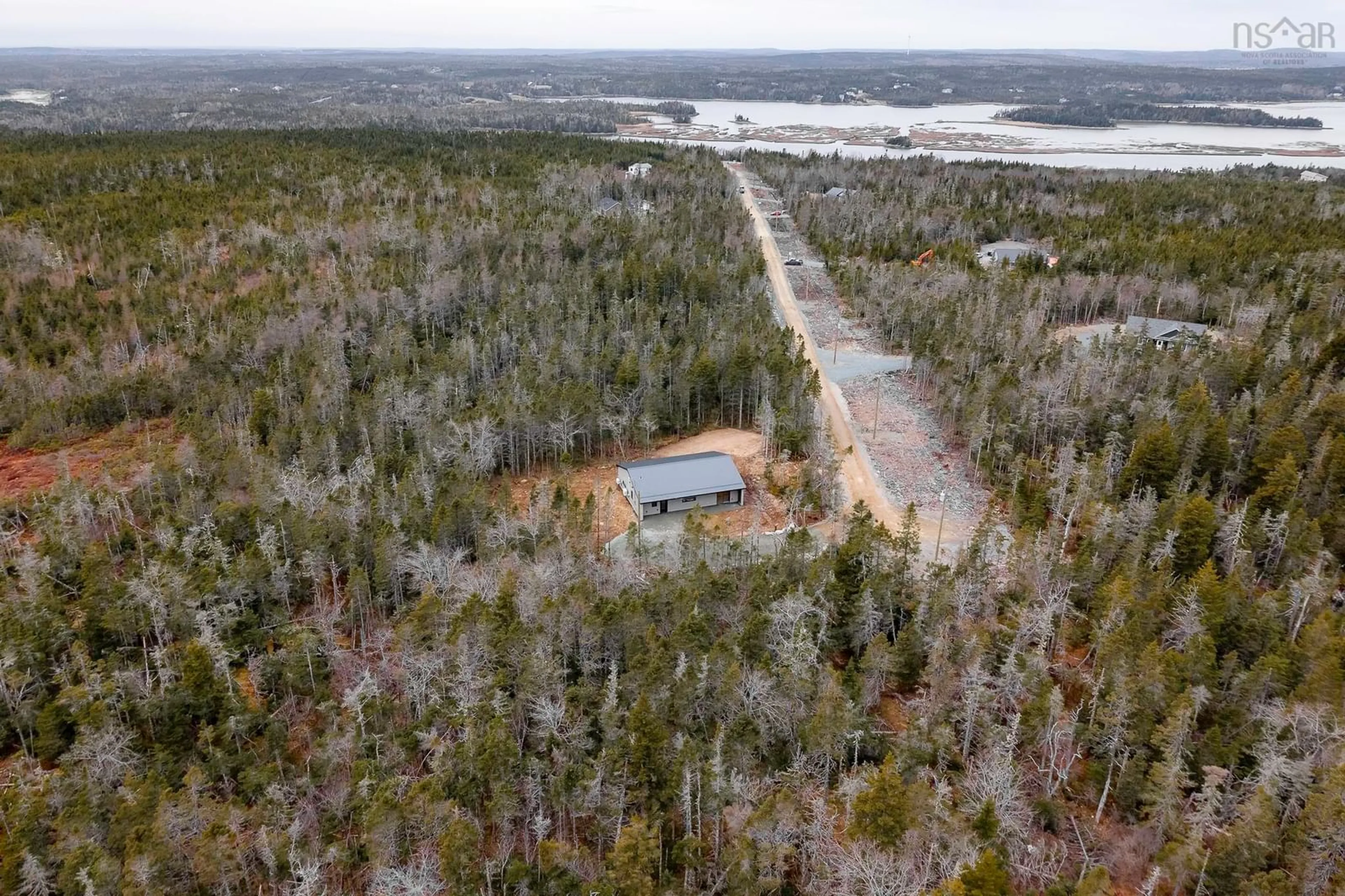A pic from outside/outdoor area/front of a property/back of a property/a pic from drone, water/lake/river/ocean view for 165 Beau Run, East Petpeswick Nova Scotia B0J 2L0