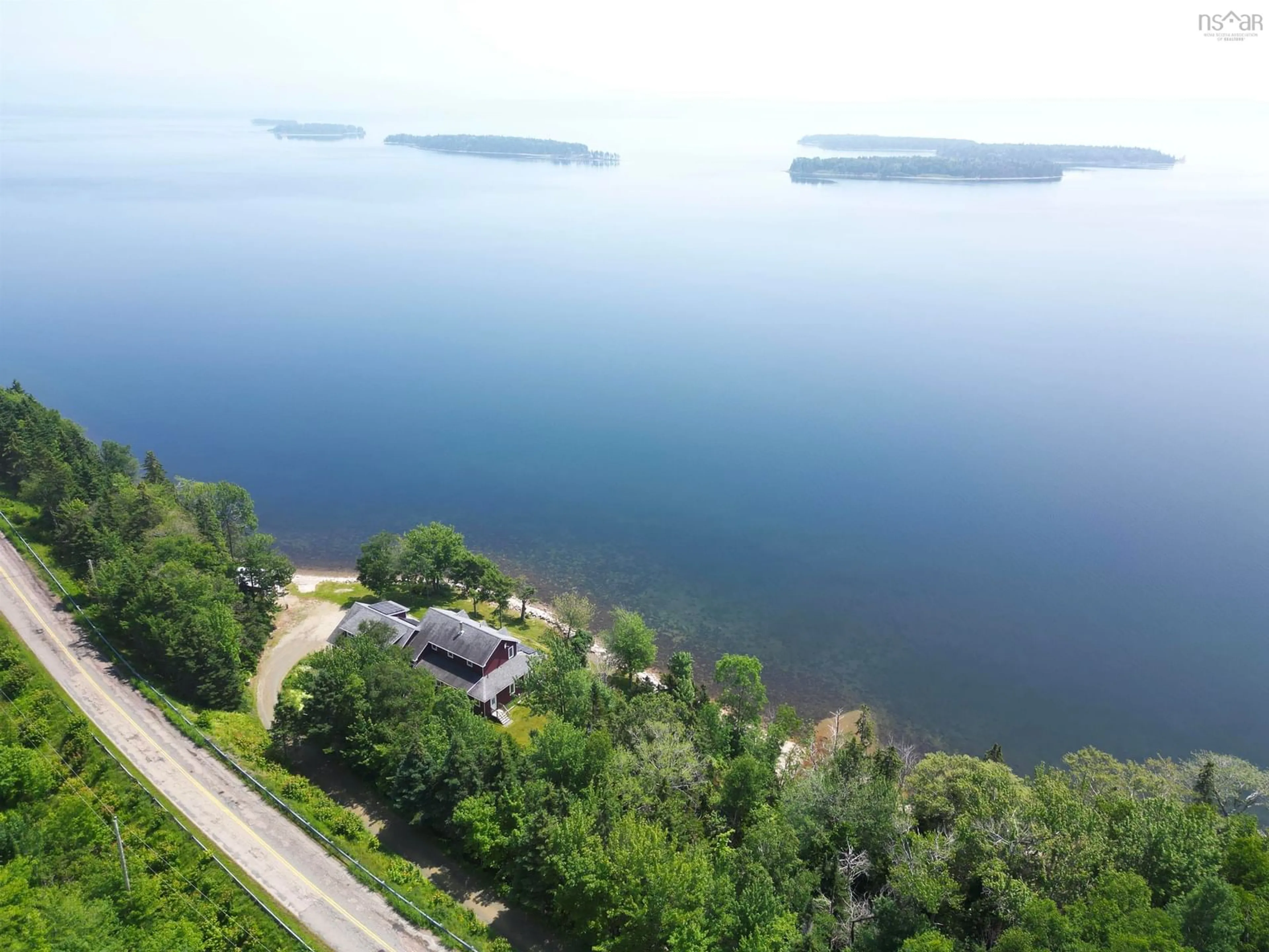A pic from outside/outdoor area/front of a property/back of a property/a pic from drone, water/lake/river/ocean view for 5276 Marble Mountain Rd., Marble Mountain Nova Scotia B0E 3K0