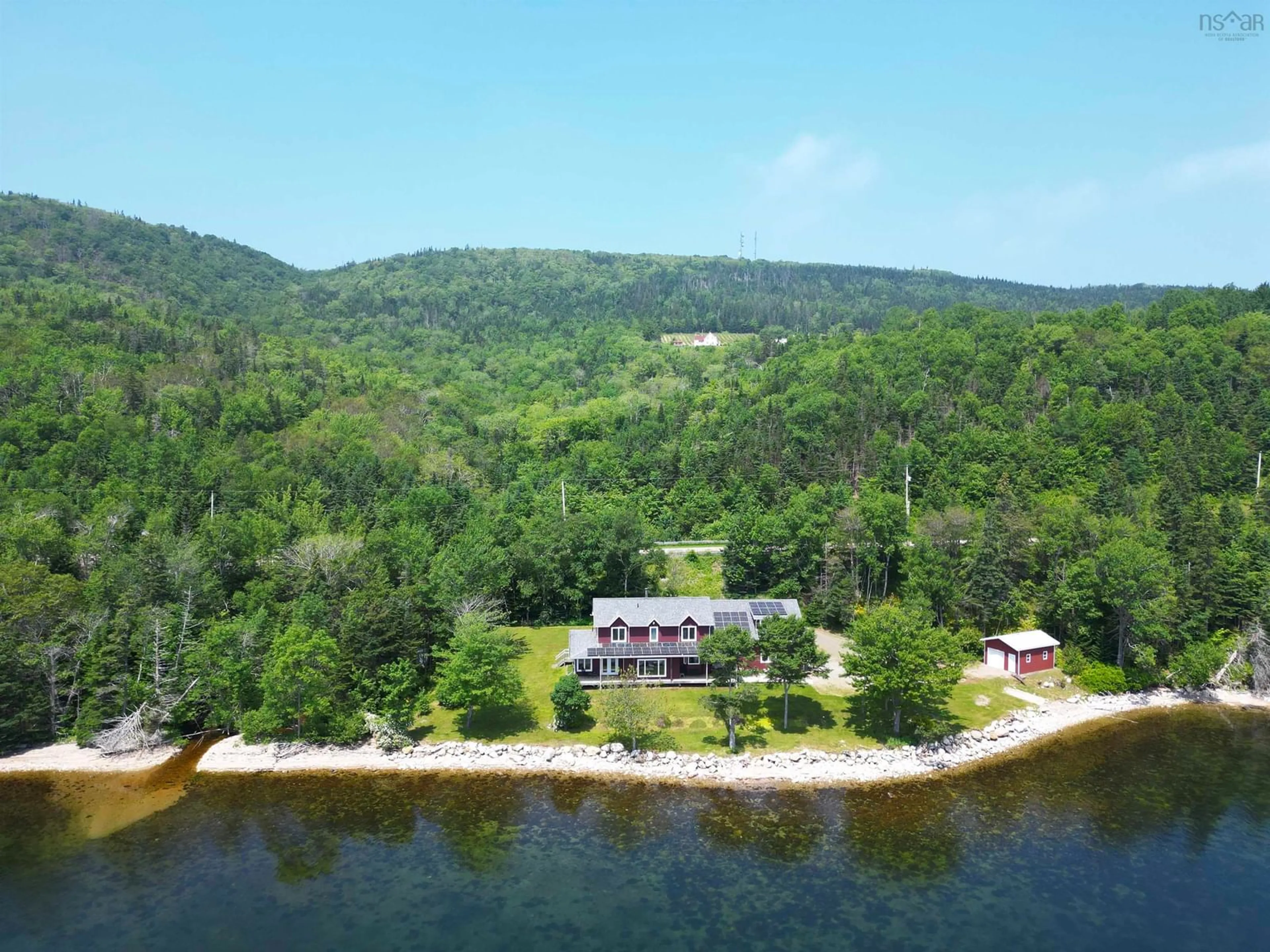 A pic from outside/outdoor area/front of a property/back of a property/a pic from drone, water/lake/river/ocean view for 5276 Marble Mountain Rd., Marble Mountain Nova Scotia B0E 3K0