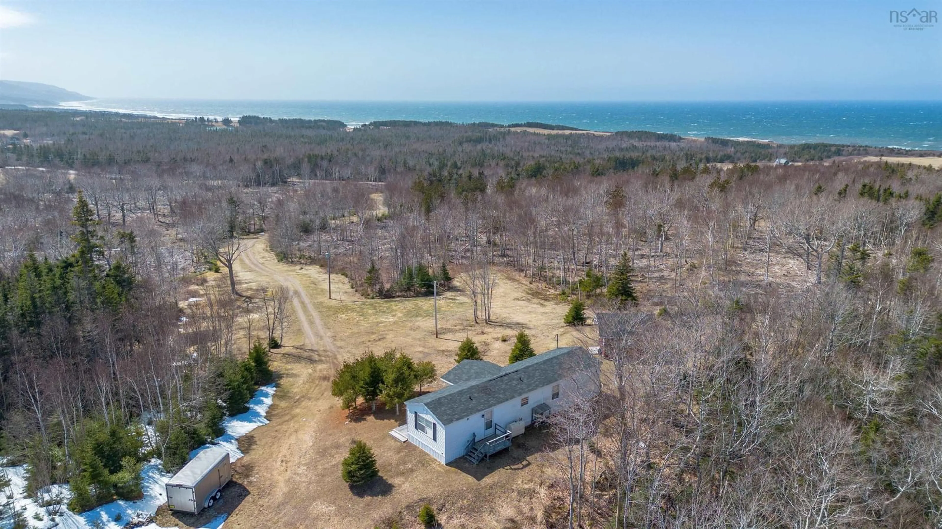 A pic from outside/outdoor area/front of a property/back of a property/a pic from drone, water/lake/river/ocean view for 258 Broad Cove Marsh Rd, Inverness County Nova Scotia B0E 1N0