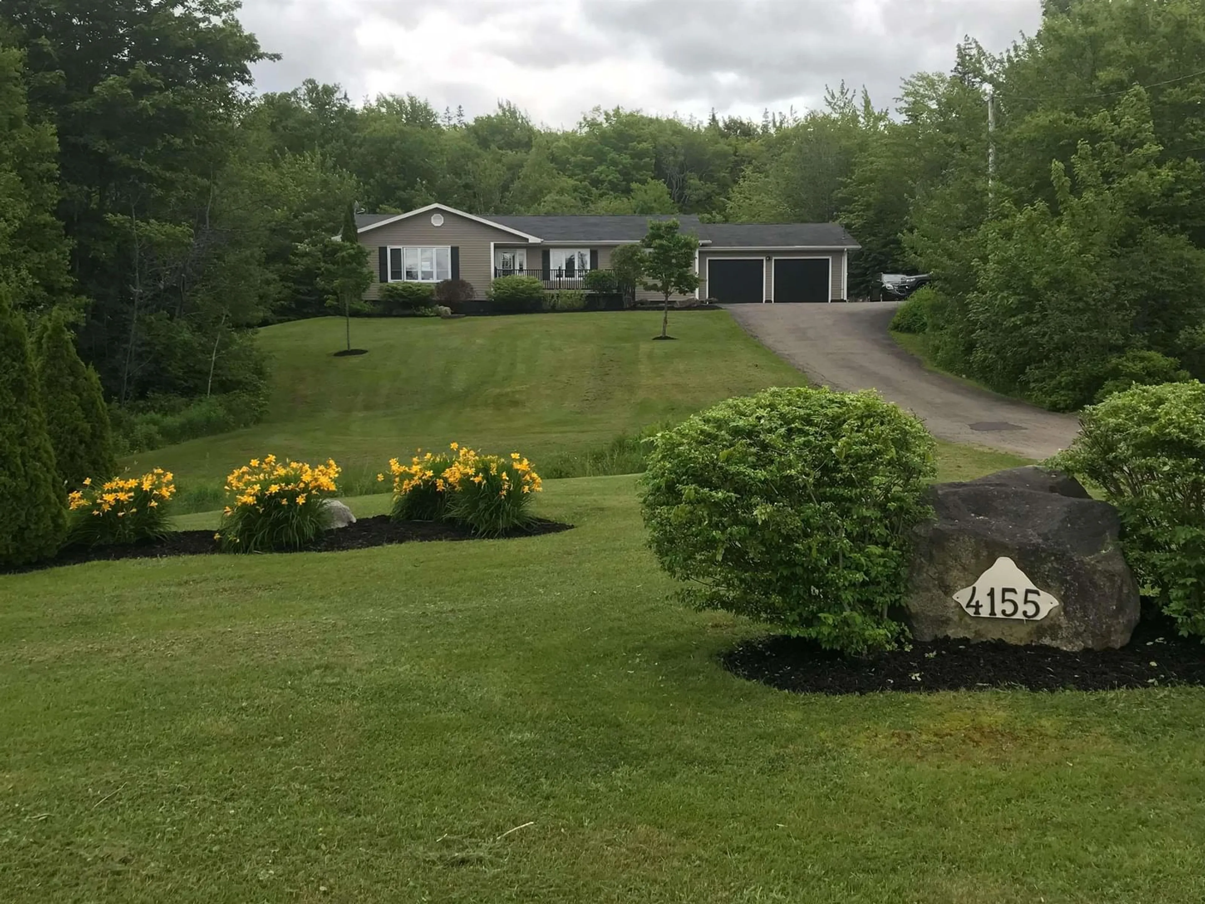 A pic from outside/outdoor area/front of a property/back of a property/a pic from drone, unknown for 4155 East Bay Hwy, East Bay Nova Scotia B1J 1M9