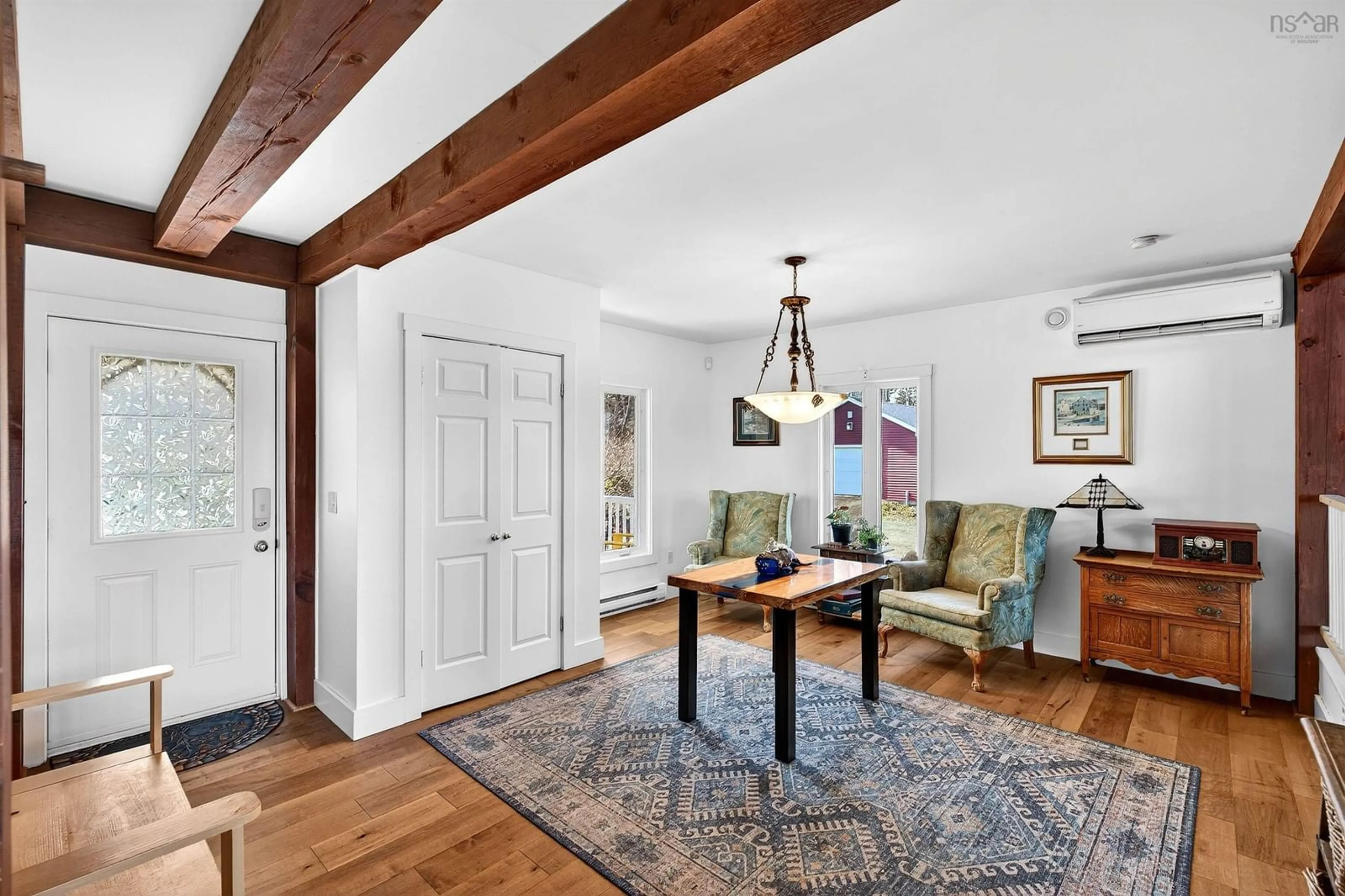Living room with furniture, wood/laminate floor for 43 Bayview Shore Rd, Bay View Nova Scotia B0V 1A0