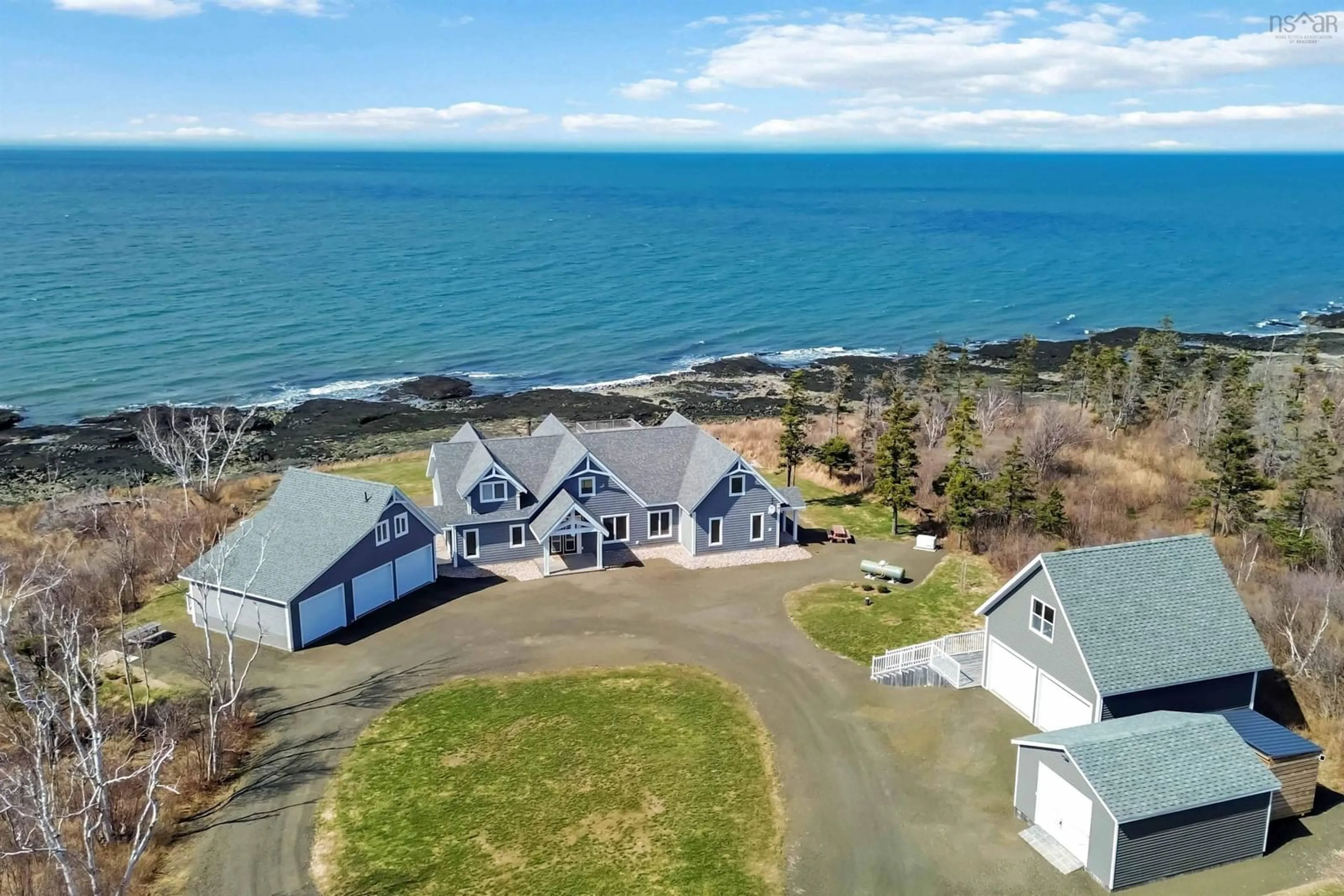 A pic from outside/outdoor area/front of a property/back of a property/a pic from drone, water/lake/river/ocean view for 5199 Shore Rd, Parkers Cove Nova Scotia B0S 1L0