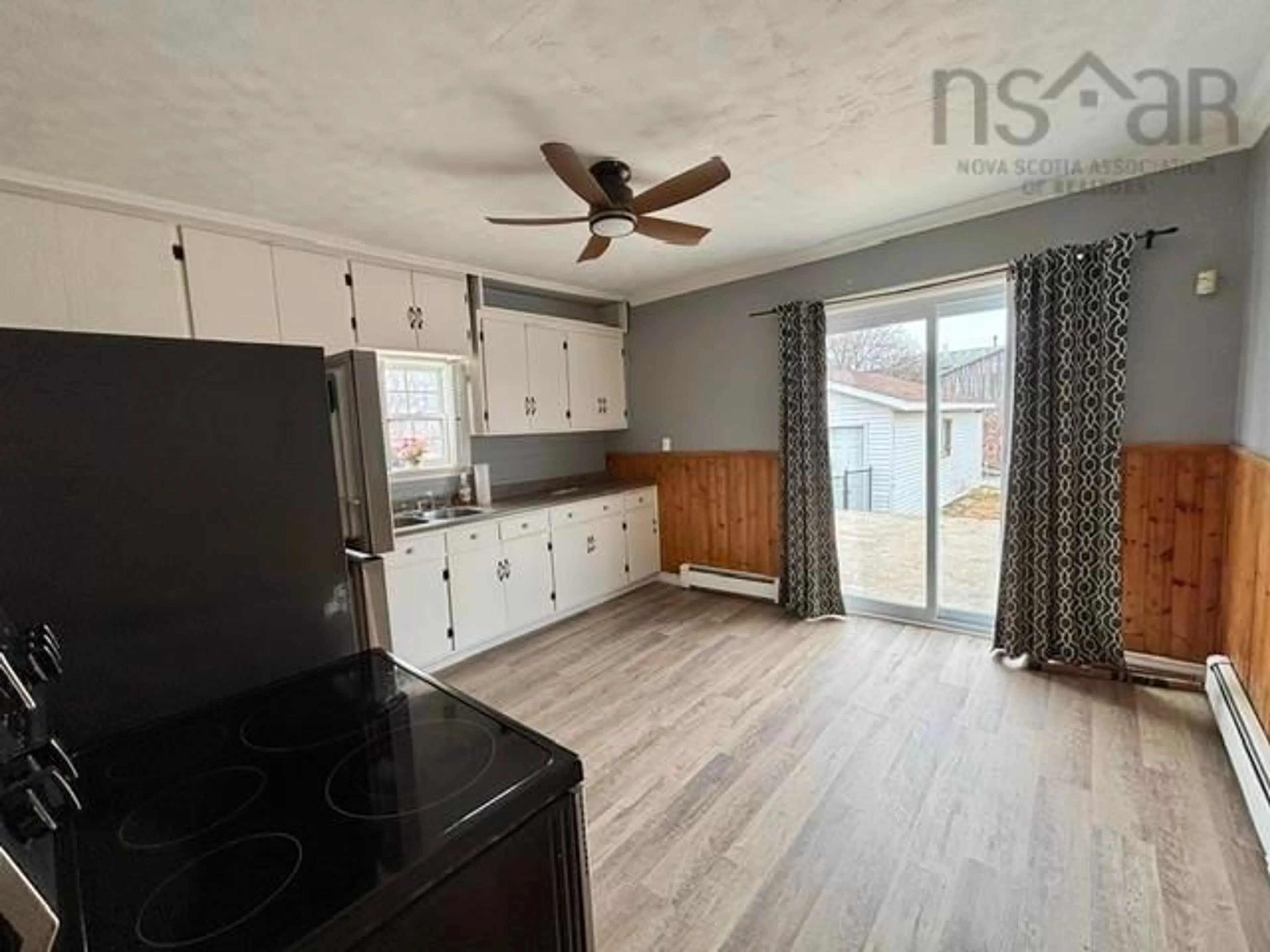 Open concept kitchen, wood/laminate floor for 55 Sterling Rd, Glace Bay Nova Scotia B1A 3X3
