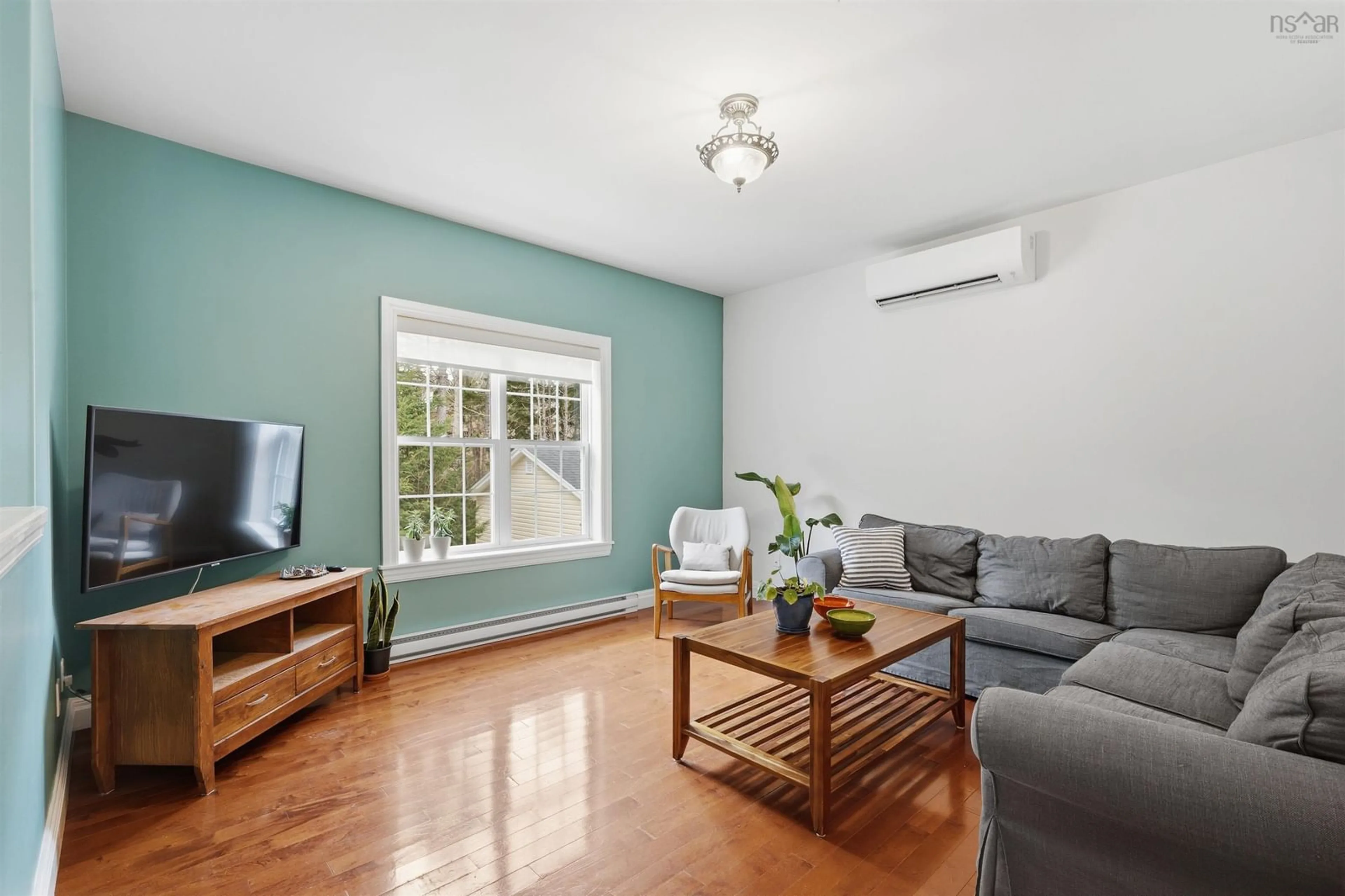 Living room with furniture, wood/laminate floor for 39 Roma Dr, Head Of Chezzetcook Nova Scotia B0J 2L0