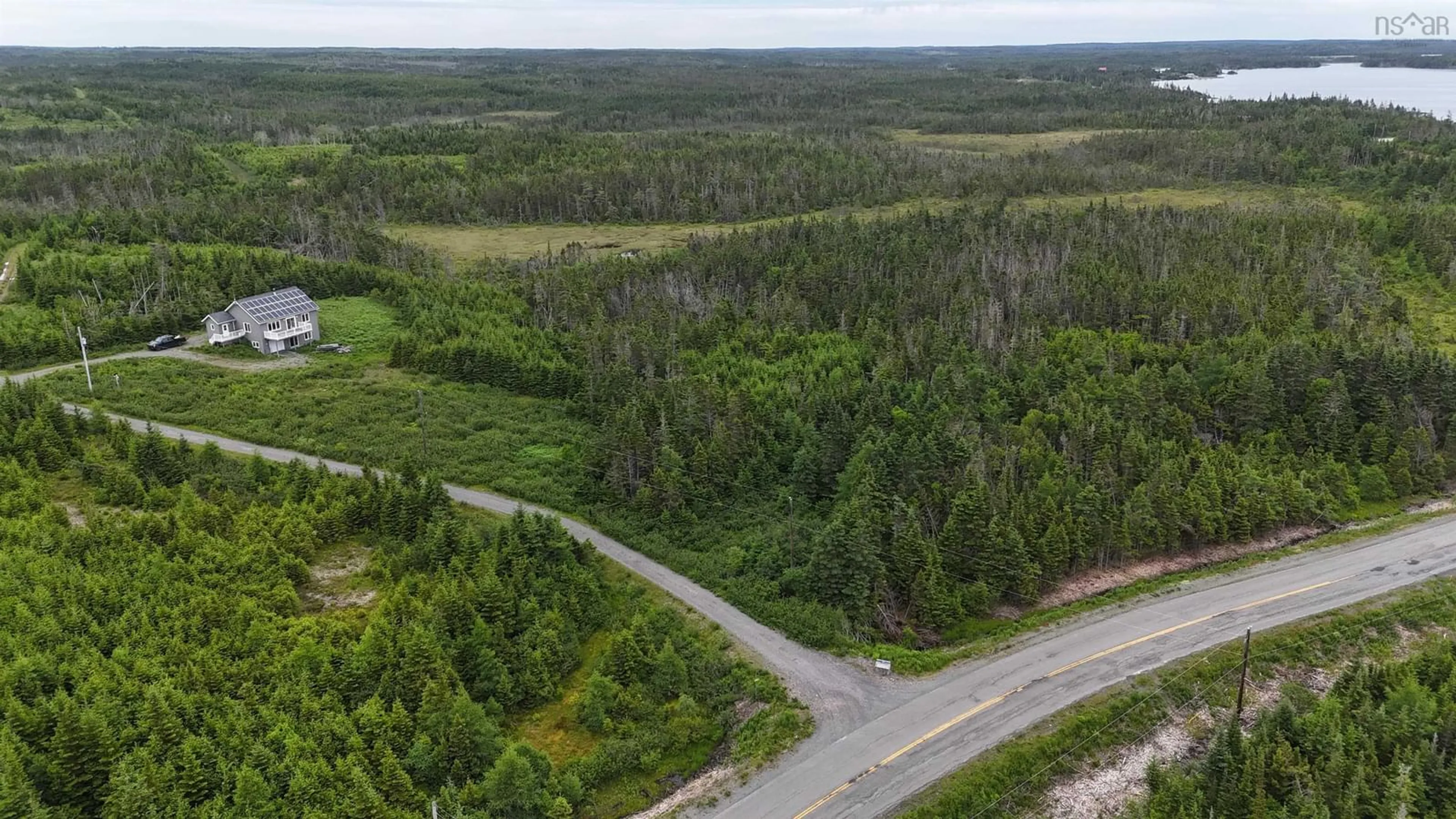 A pic from outside/outdoor area/front of a property/back of a property/a pic from drone, forest/trees view for 4381 St. Peter's Fourchu Rd, Grand River Nova Scotia B0E 1M0