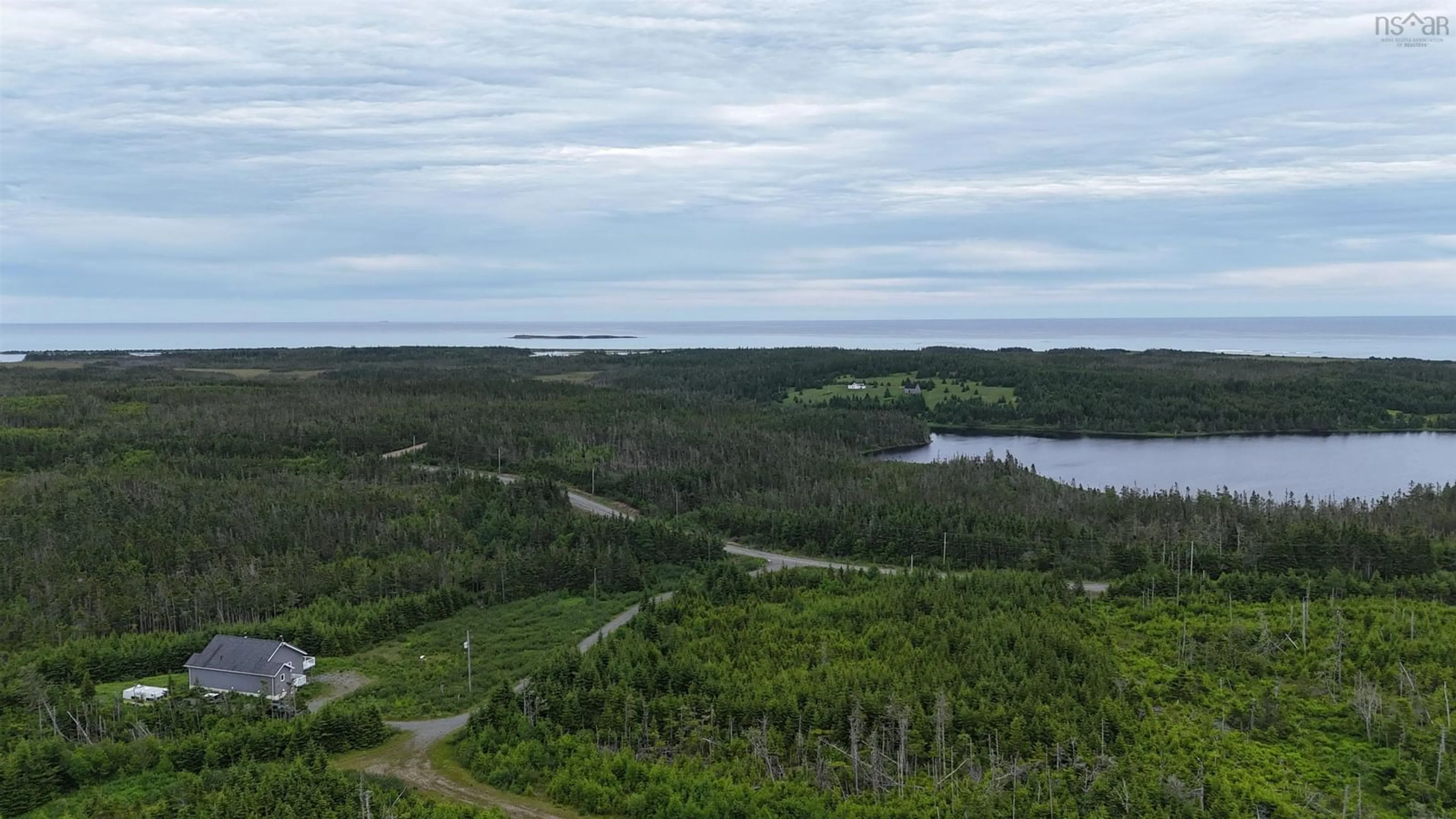 A pic from outside/outdoor area/front of a property/back of a property/a pic from drone, water/lake/river/ocean view for 4381 St. Peter's Fourchu Rd, Grand River Nova Scotia B0E 1M0