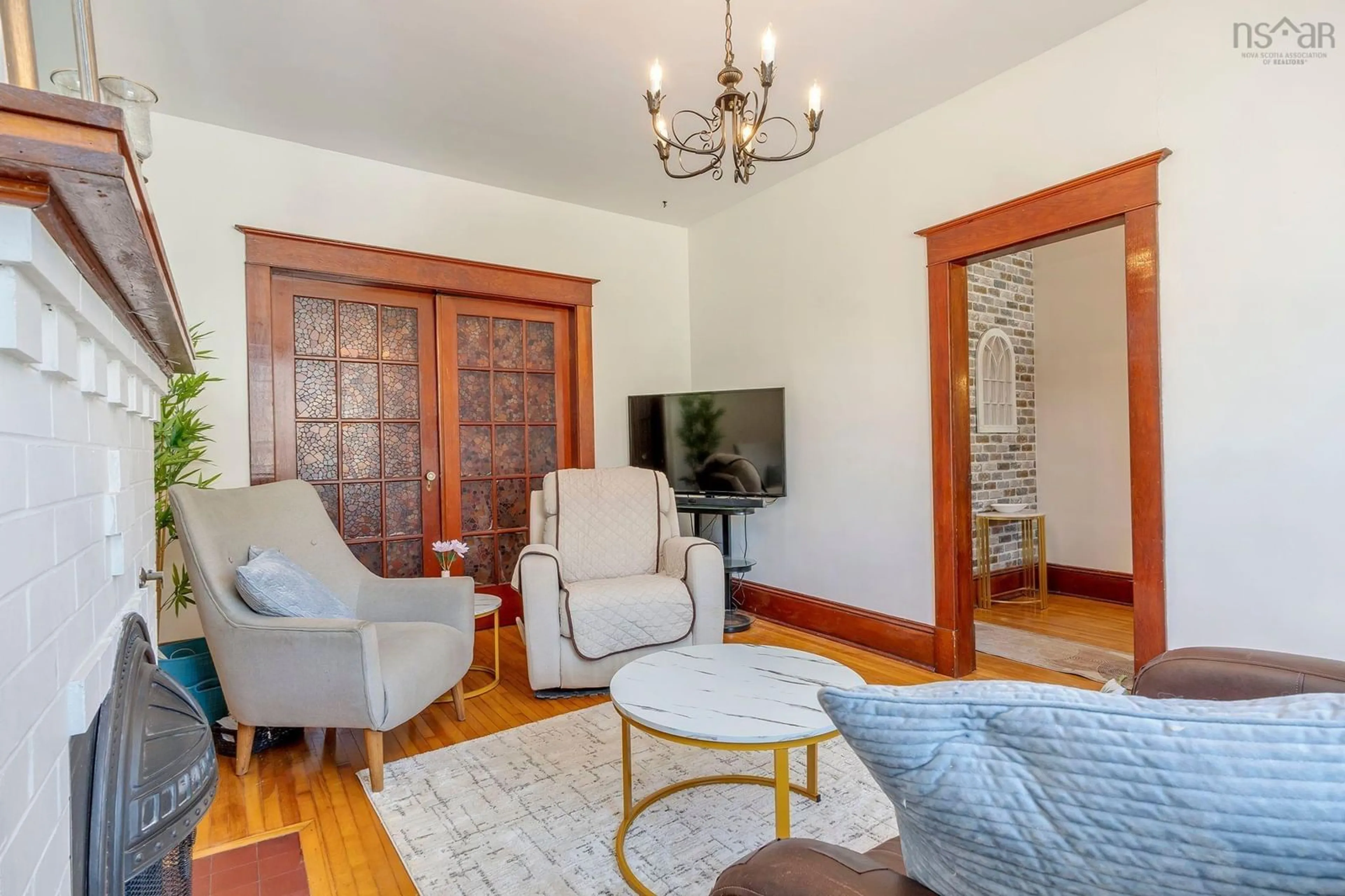 Living room with furniture, wood/laminate floor for 6030/6032 Cherry St, Halifax Nova Scotia B3H 2K3