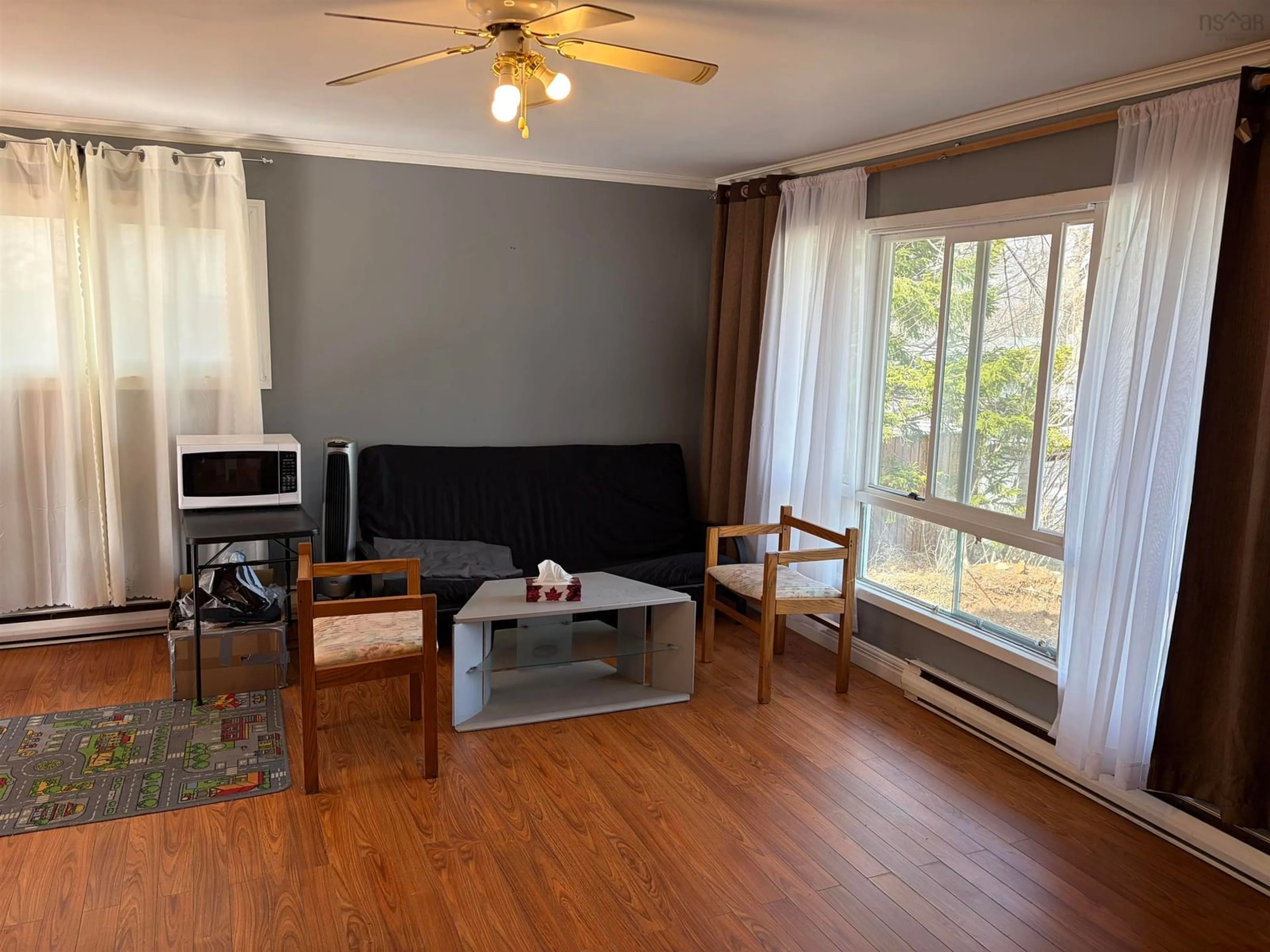 Living room with furniture, wood/laminate floor for 10 Chandler Dr, Lower Sackville Nova Scotia B4C 1X6
