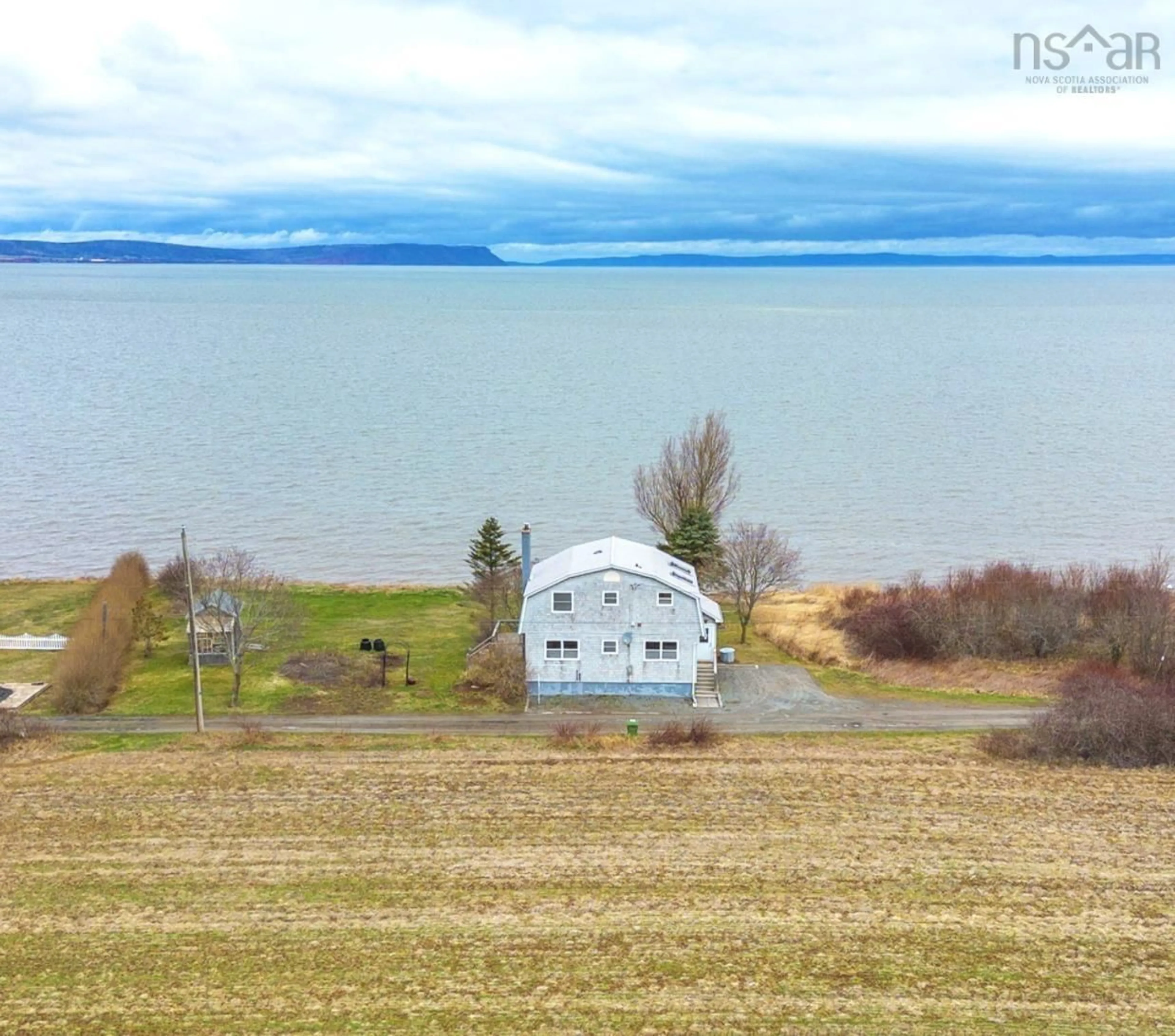A pic from outside/outdoor area/front of a property/back of a property/a pic from drone, water/lake/river/ocean view for 102 Pheasant Rd, North Grand Pre Nova Scotia B0P 1M0