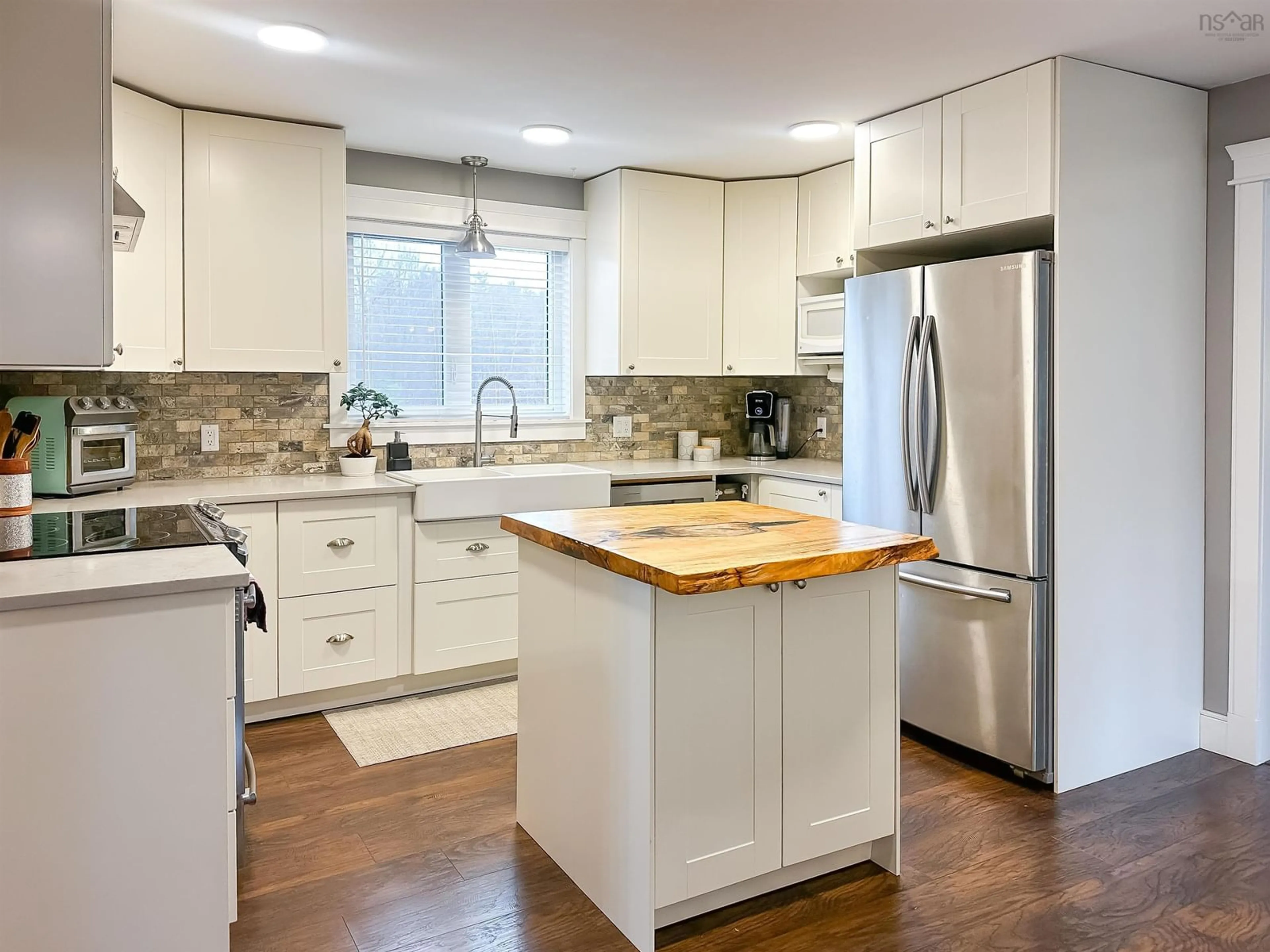 Open concept kitchen, wood/laminate floor for 690 Maple St, East Berwick Nova Scotia B0P 1E0