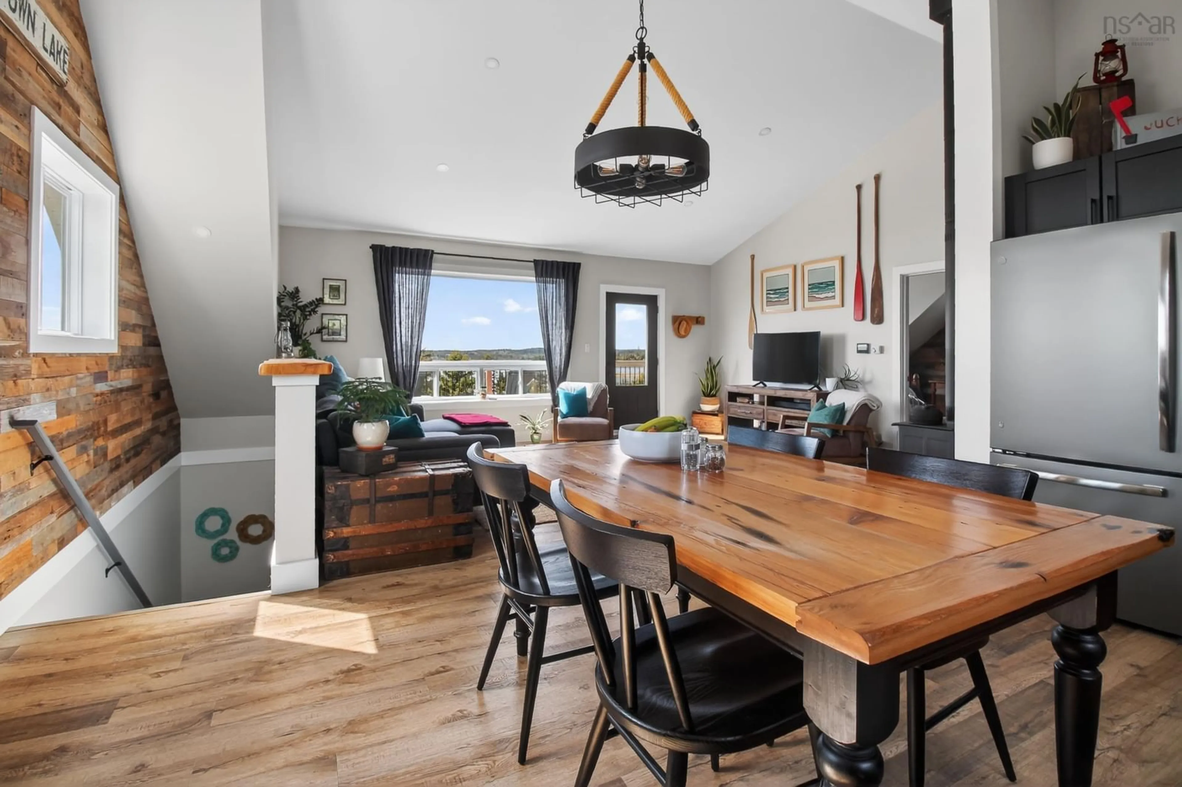 Open concept kitchen, wood/laminate floor for 232 Leslie Rd, East Lawrencetown Nova Scotia B2Z 1T4