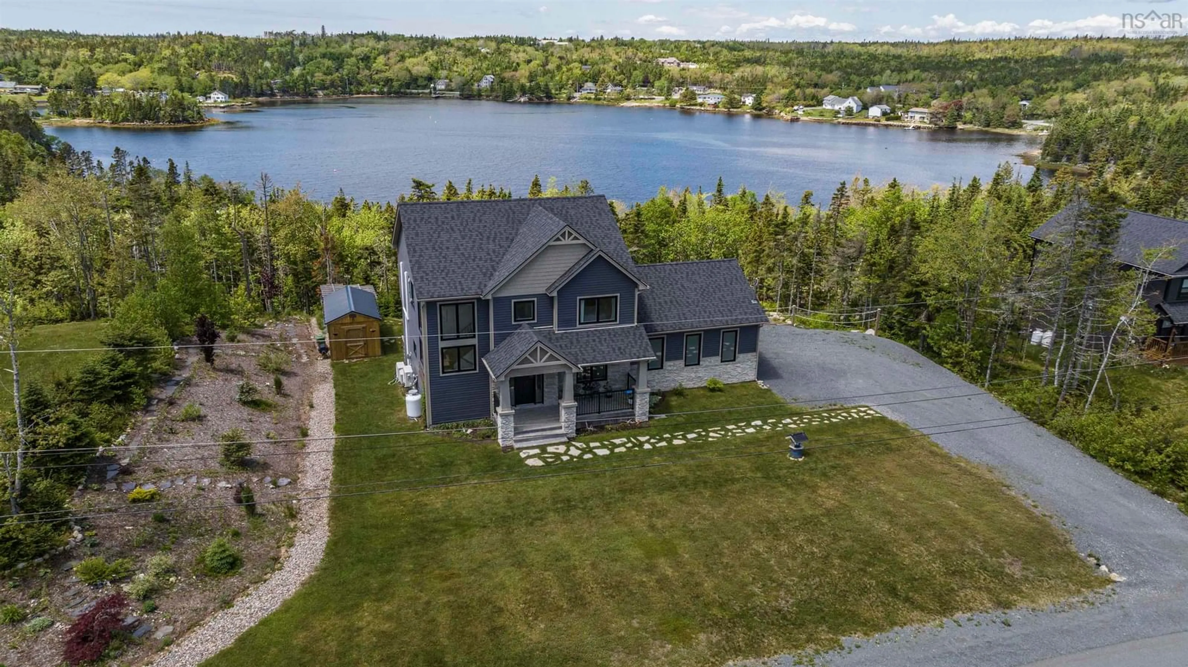 A pic from outside/outdoor area/front of a property/back of a property/a pic from drone, water/lake/river/ocean view for 122 Hargrove Lane, Whites Lake Nova Scotia B3T 0H8