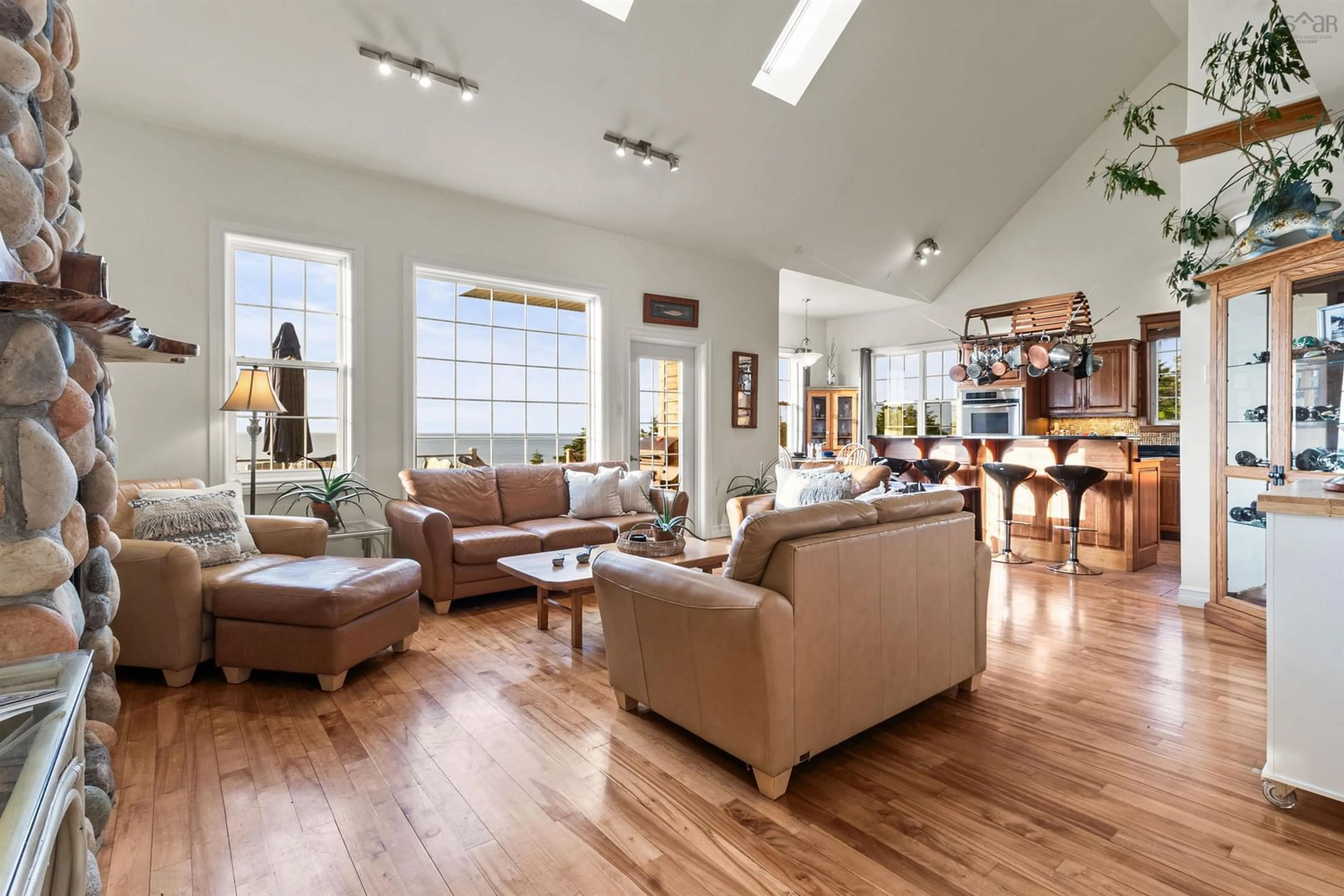 Living room with furniture, wood/laminate floor for 4516 Highway 245, Malignant Cove Nova Scotia B2G 2L1