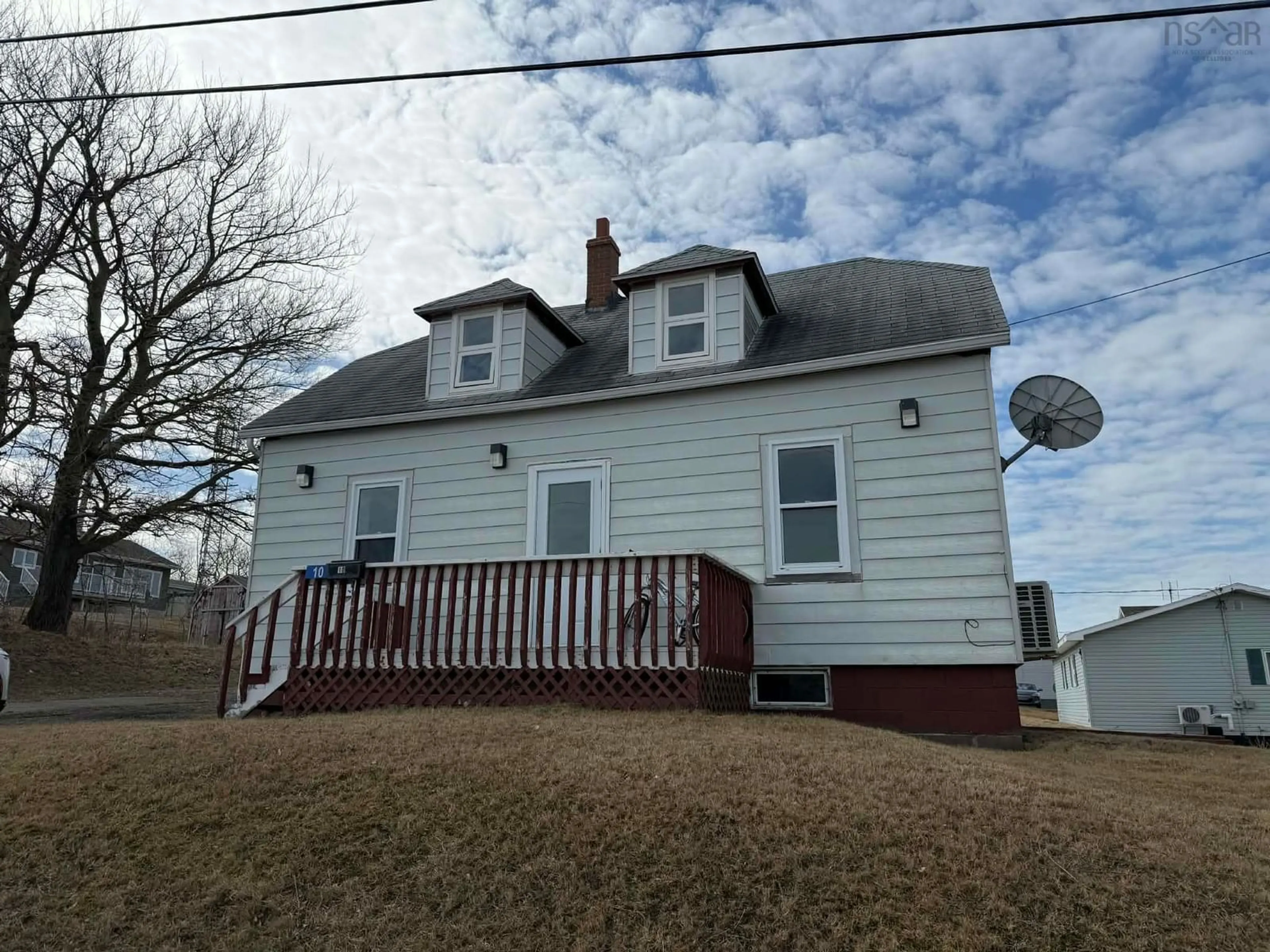 Home with vinyl exterior material, street for 10 Barren Rd, Chéticamp Nova Scotia B0E 1H0