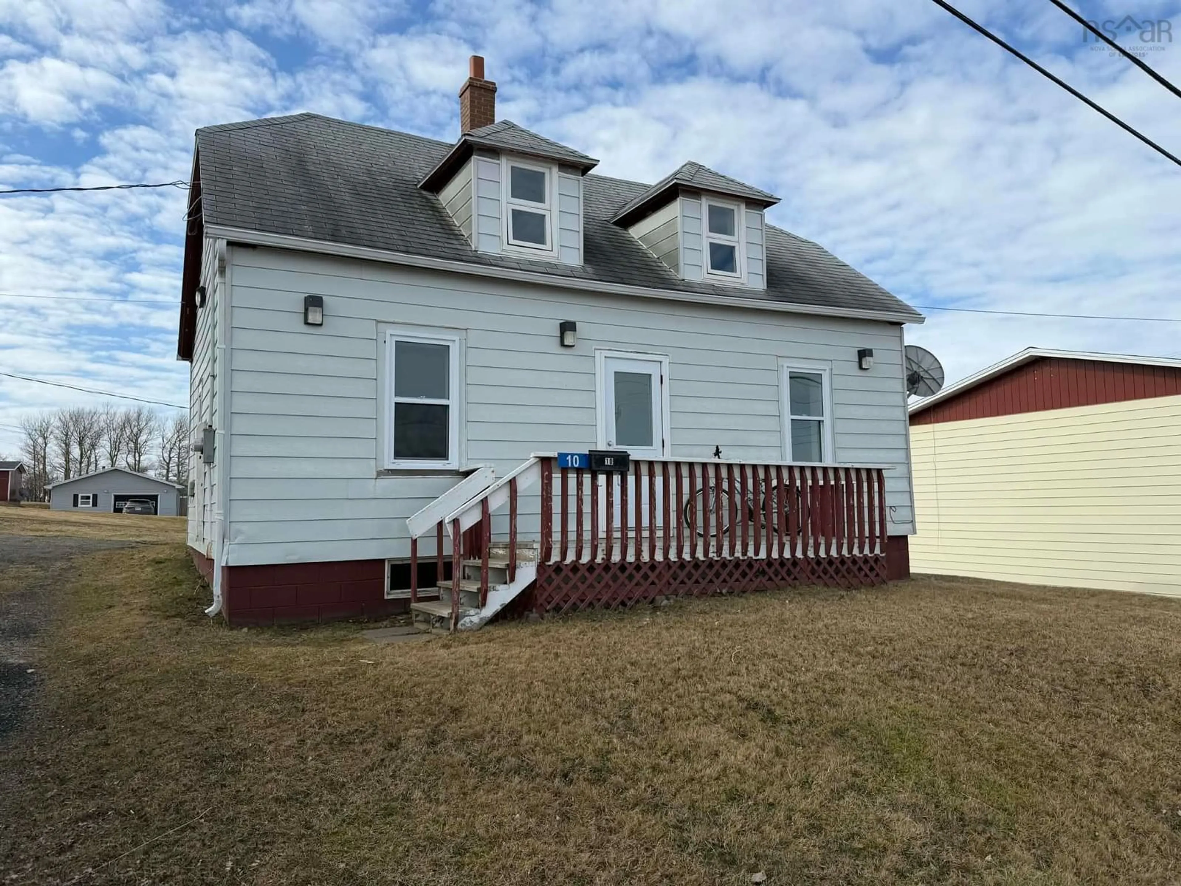 Home with vinyl exterior material, street for 10 Barren Rd, Chéticamp Nova Scotia B0E 1H0