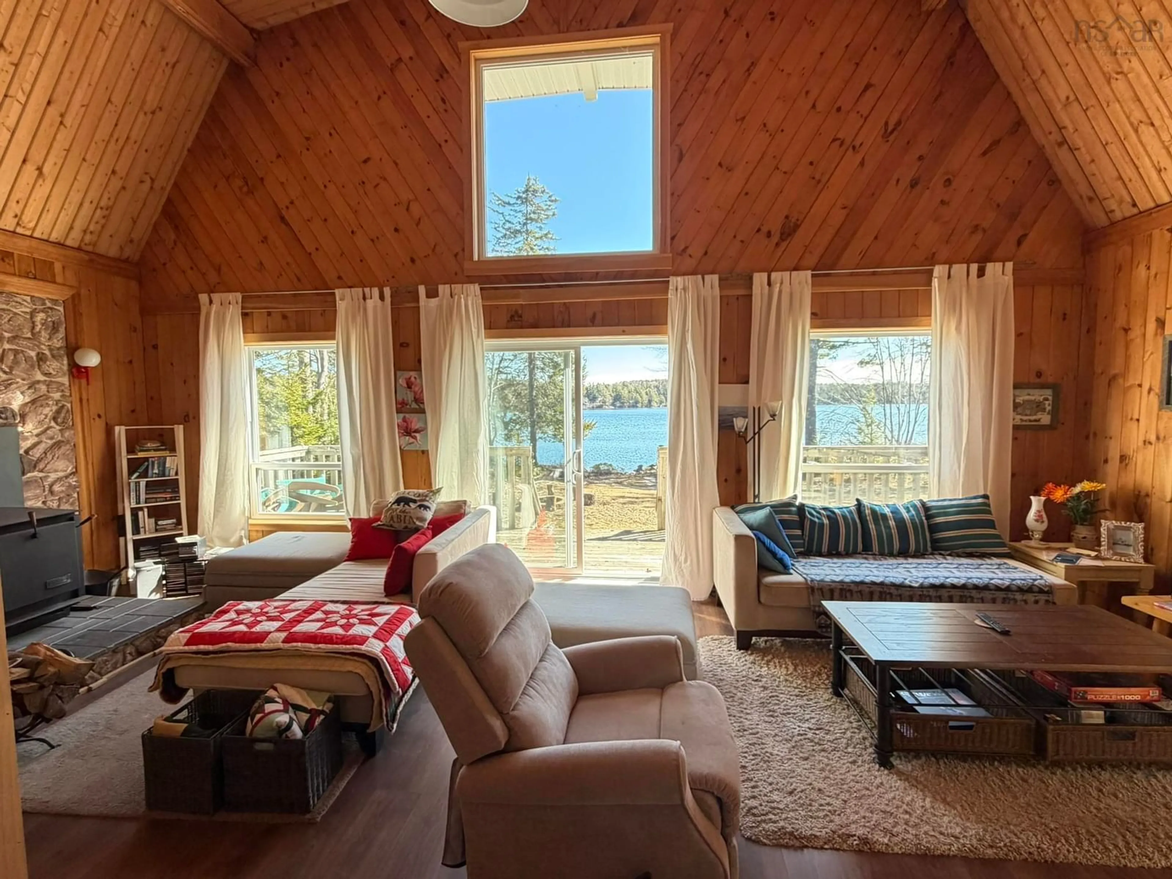 Living room with furniture, wood/laminate floor for 988 Labelle Rd, Labelle Nova Scotia B0T 1E0