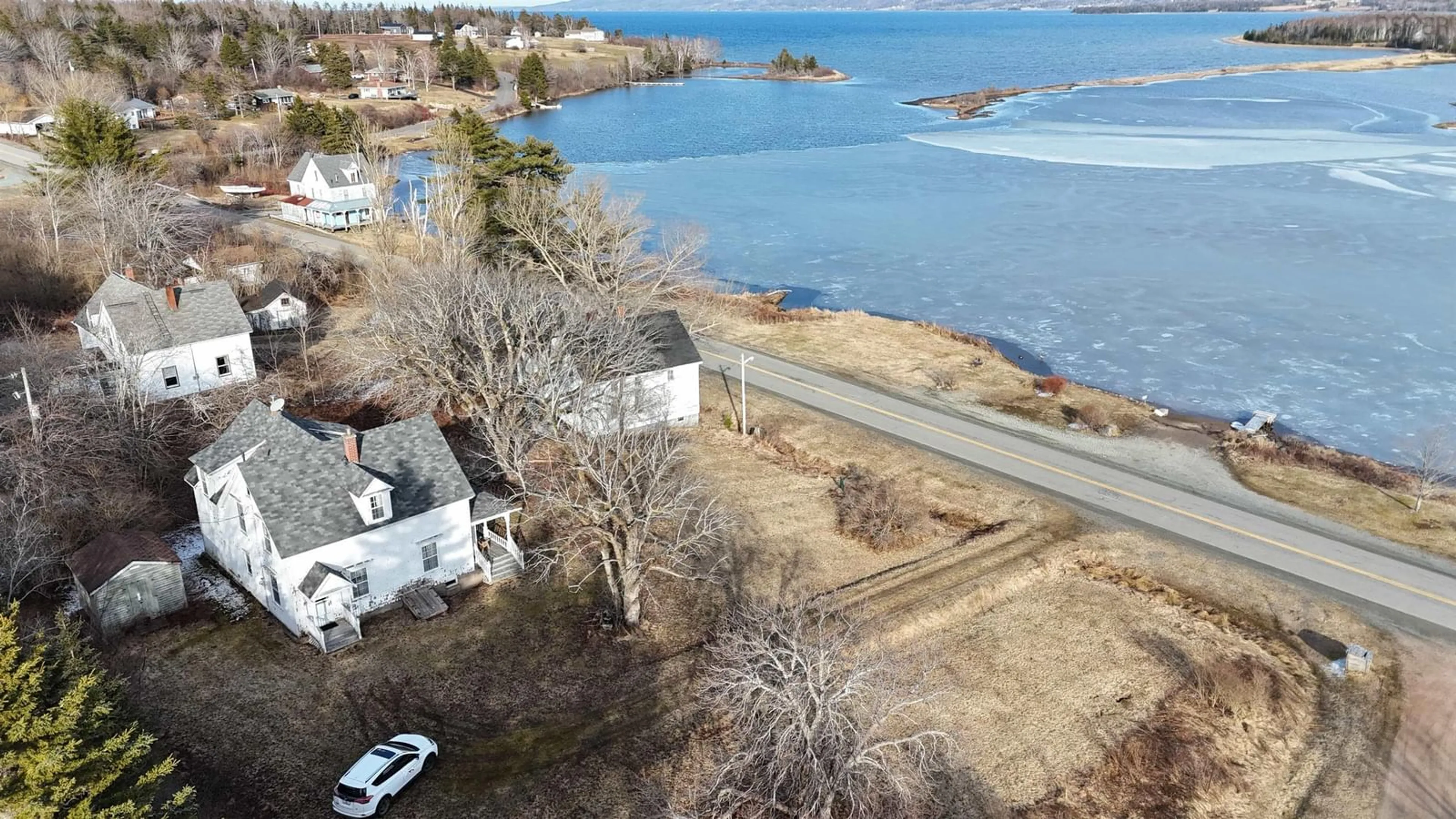 A pic from outside/outdoor area/front of a property/back of a property/a pic from drone, water/lake/river/ocean view for 2145 Marble Mountain Rd, West Bay Nova Scotia B0E 3K0