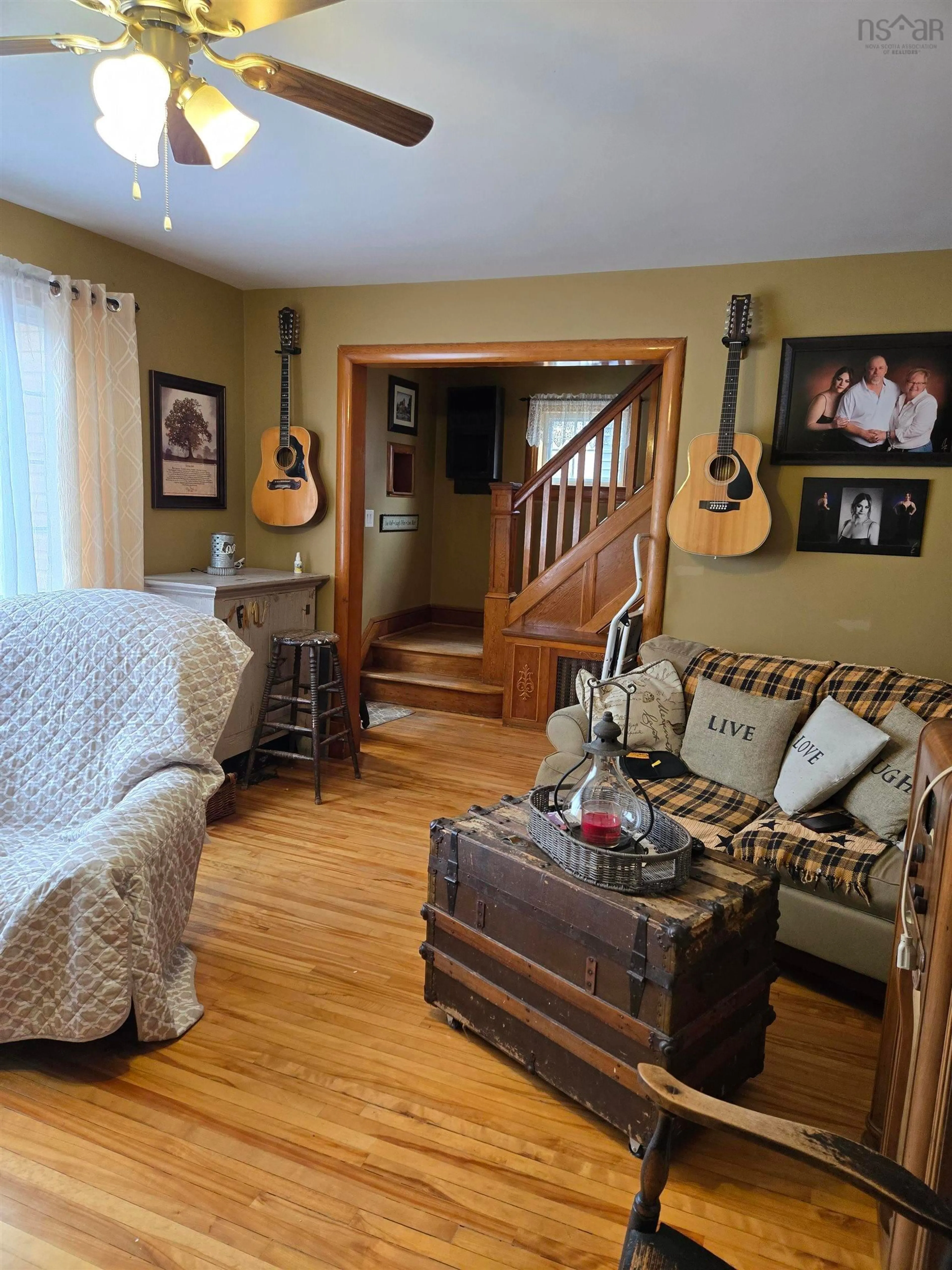 Living room with furniture, wood/laminate floor for 87 Harold Street St, Sydney Nova Scotia B1P 3M2