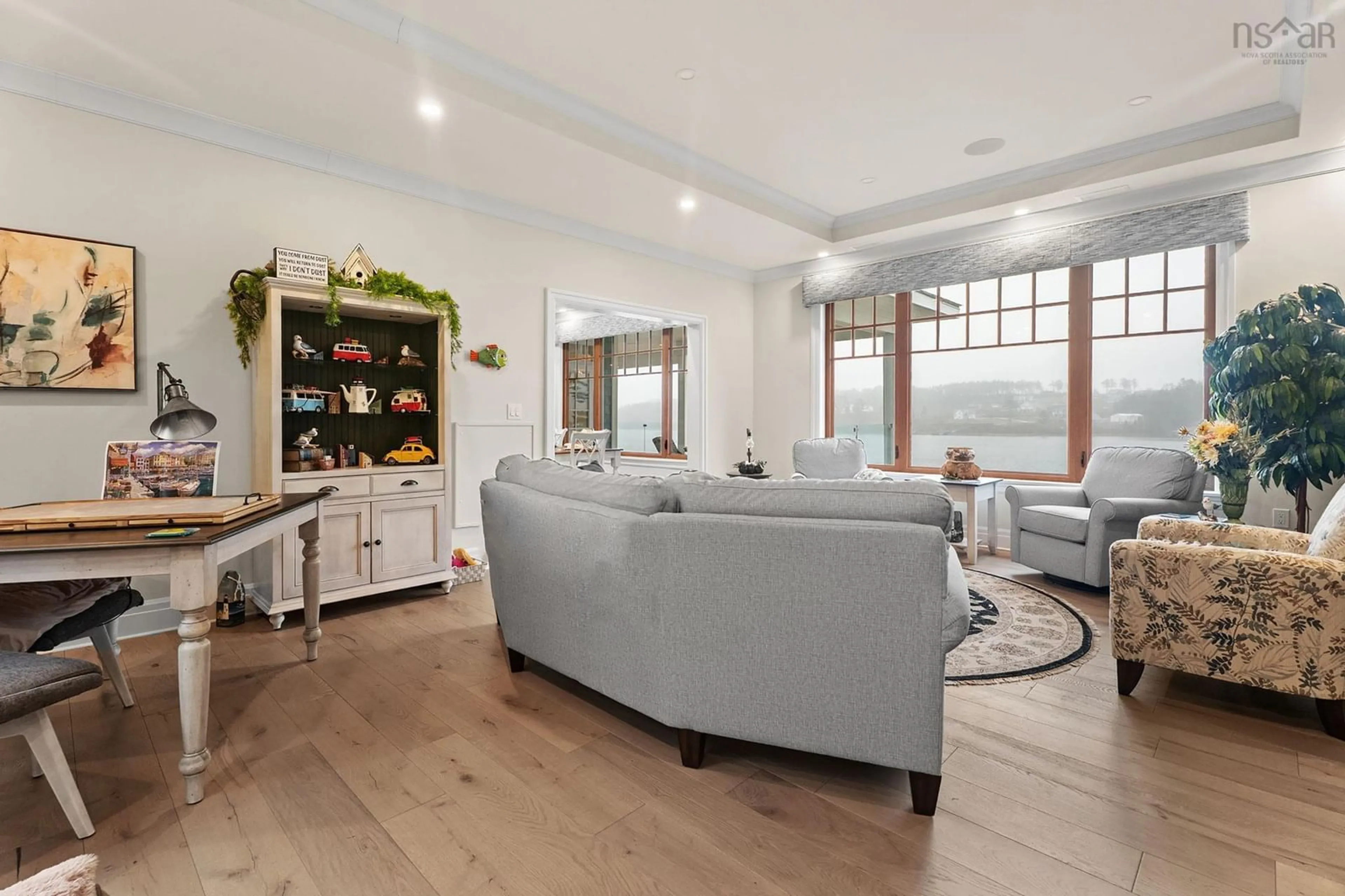Living room with furniture, wood/laminate floor for 10 Mary Lane, Marvins Island Nova Scotia B0J 1K0