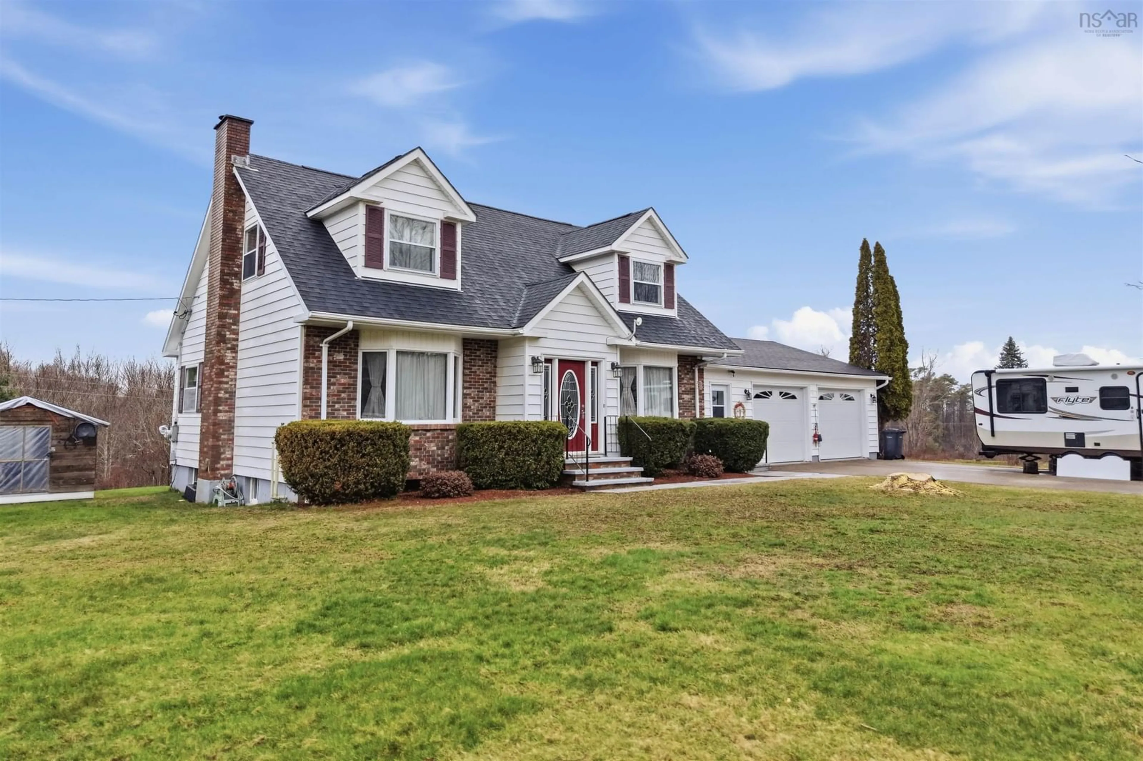 Home with vinyl exterior material, street for 123 Trout Lake Rd, Lawrencetown Nova Scotia B0S 1M0
