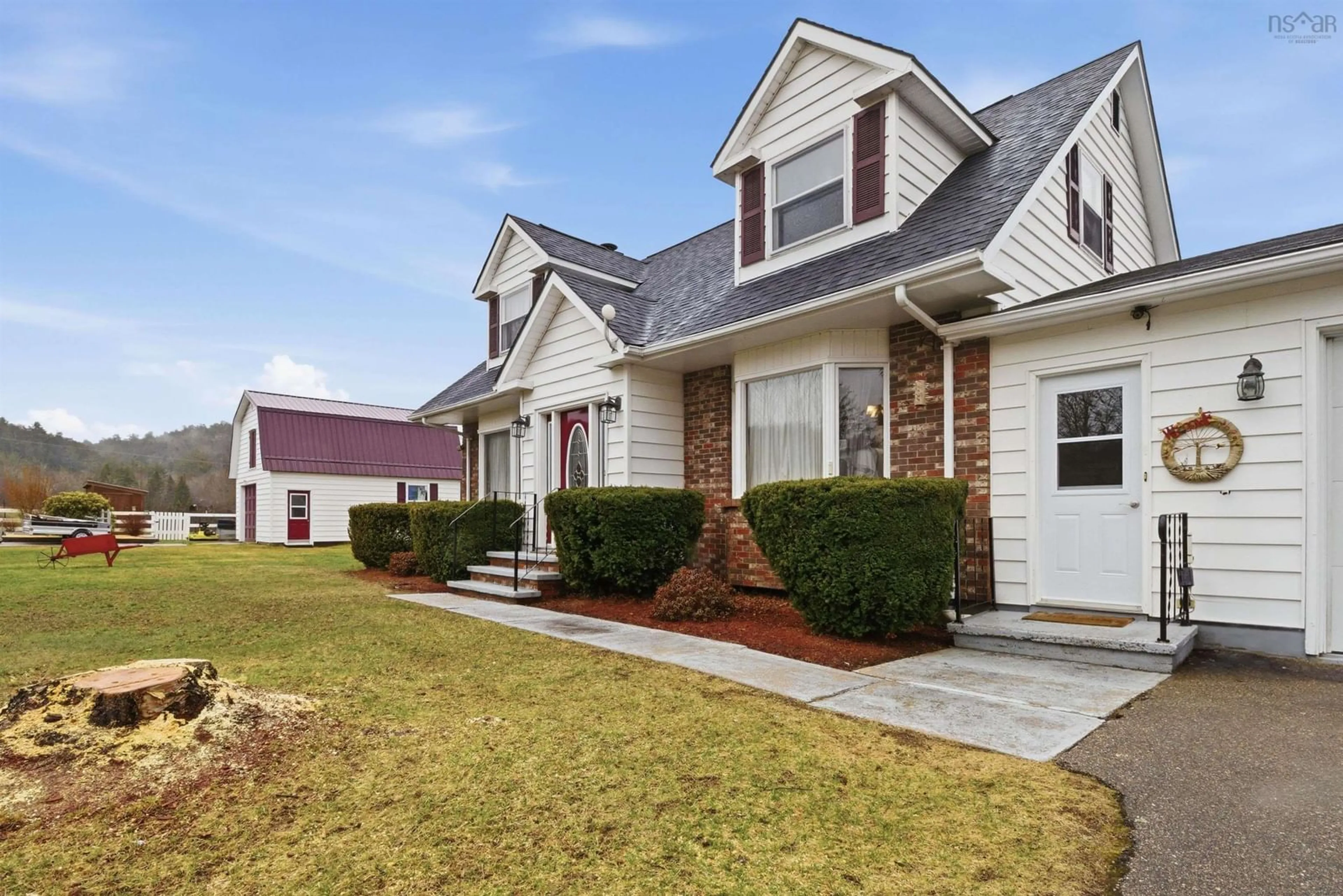 Home with vinyl exterior material, street for 123 Trout Lake Rd, Lawrencetown Nova Scotia B0S 1M0