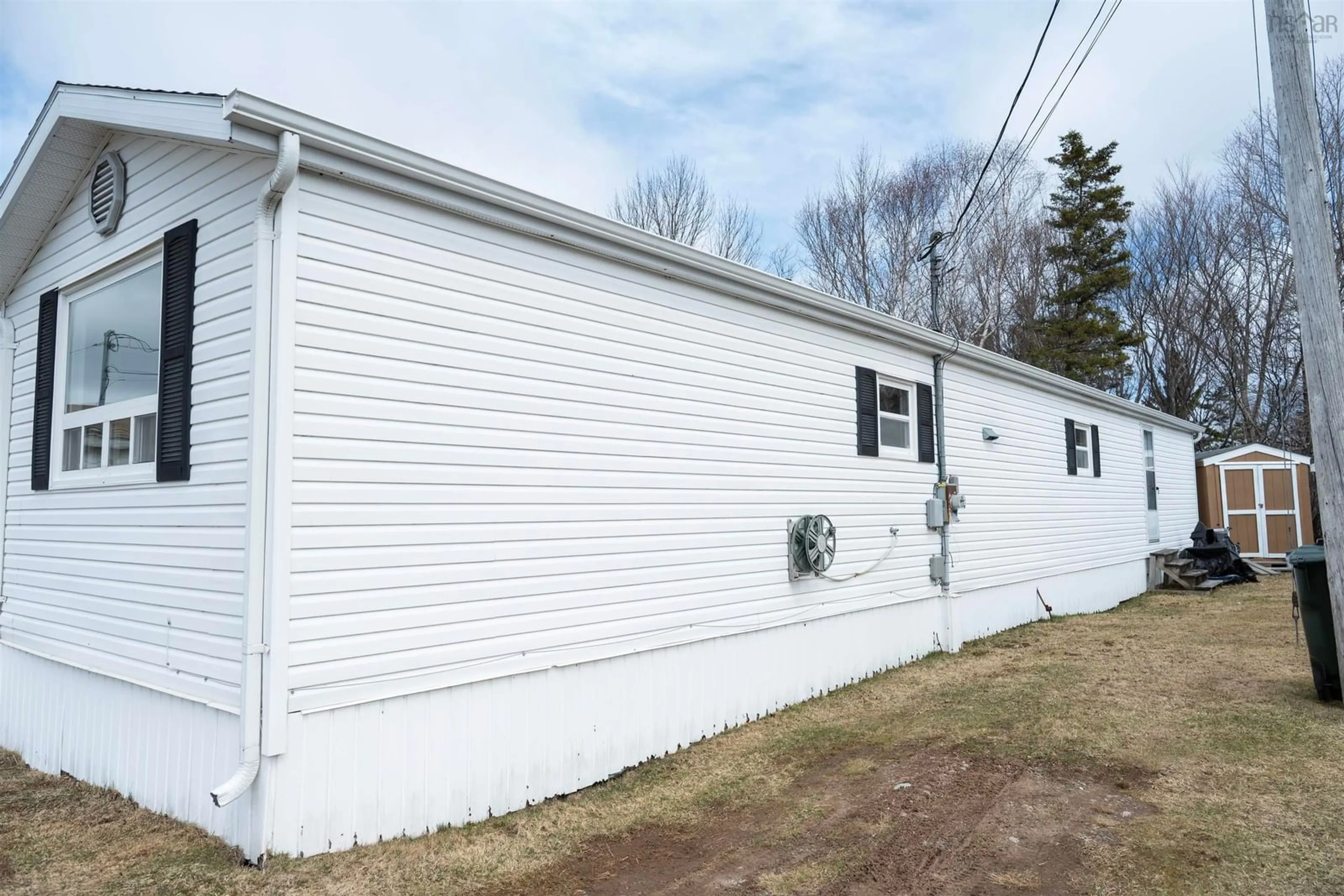 Home with vinyl exterior material, street for 27 Curry St., Howie Centre Nova Scotia B1L 1G3