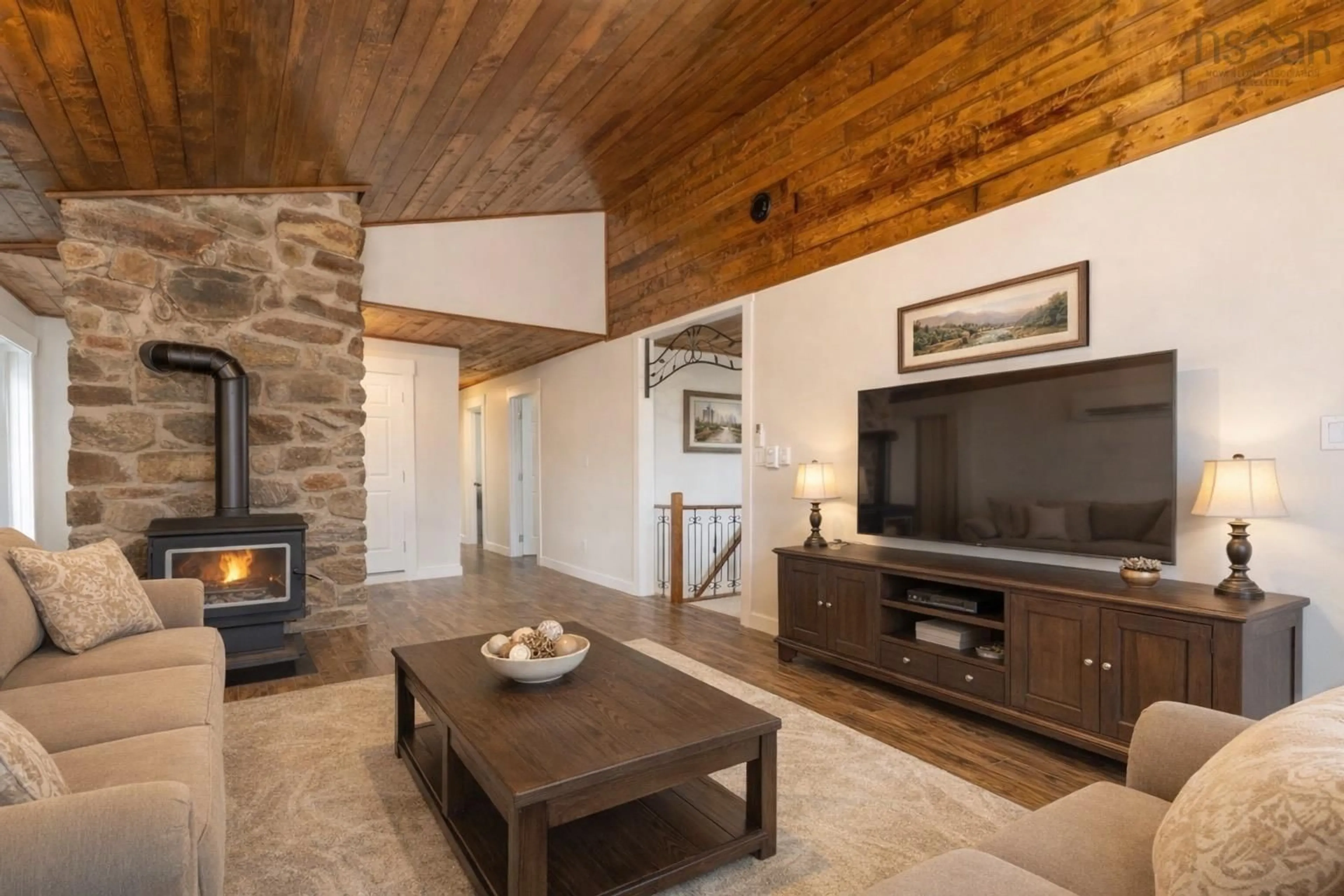 Living room with furniture, wood/laminate floor for 62 Lake Doucette Rd, Lake Doucette Nova Scotia B0W 2Y0