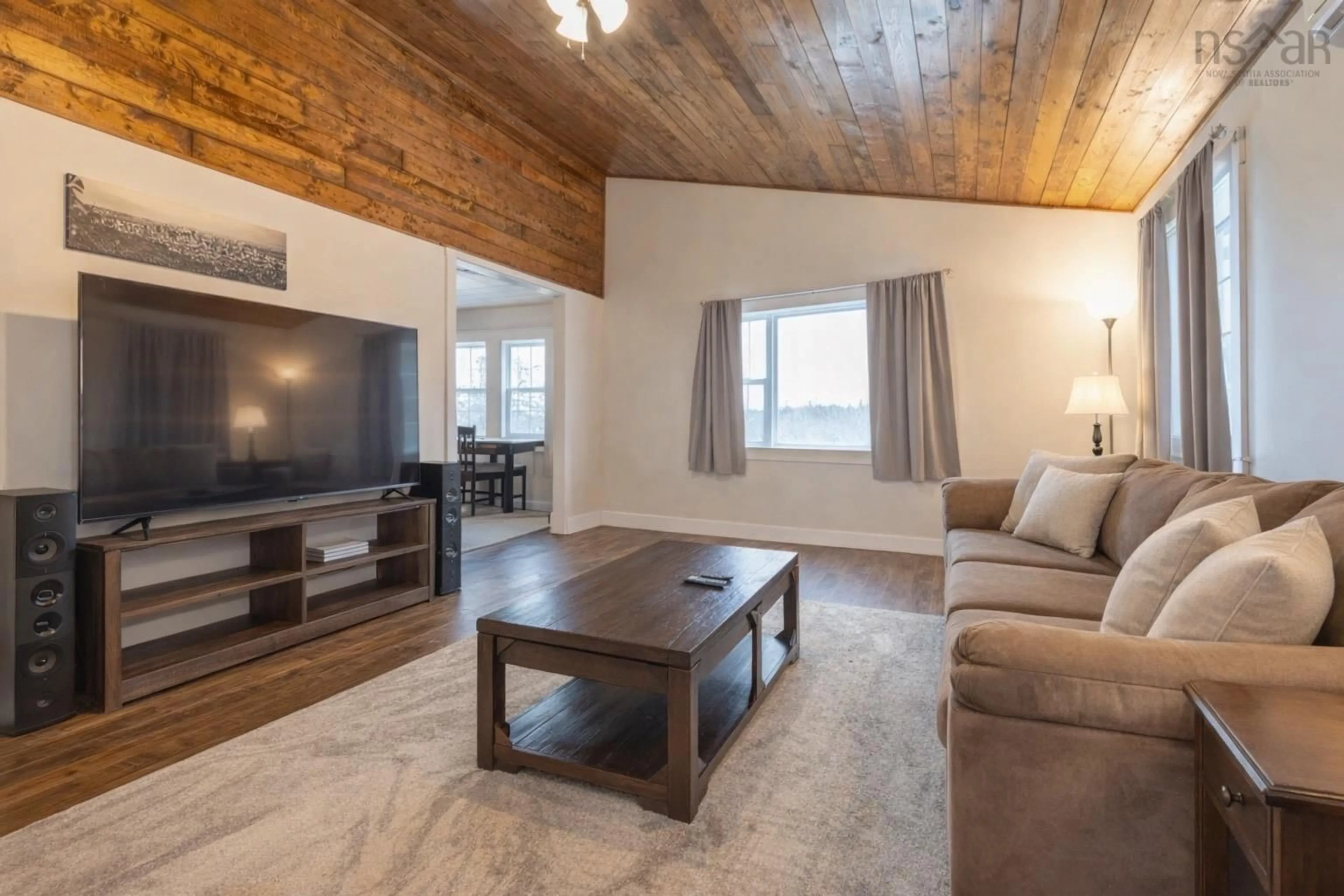 Living room with furniture, wood/laminate floor for 62 Lake Doucette Rd, Lake Doucette Nova Scotia B0W 2Y0