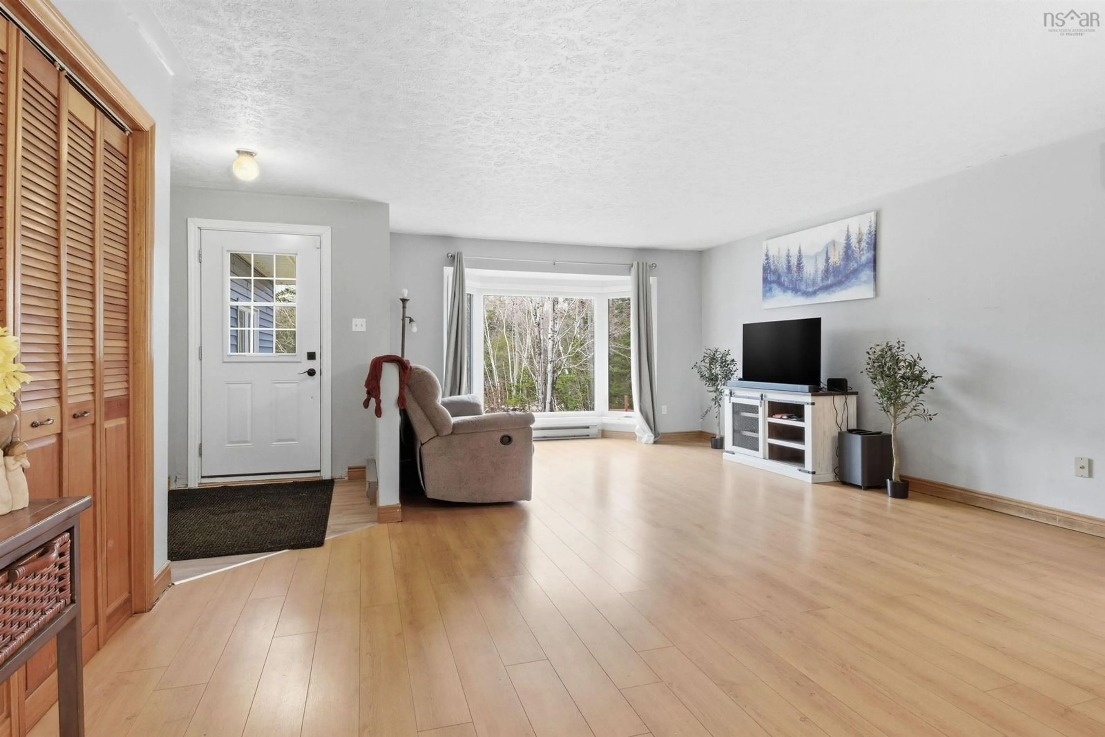 Living room with furniture, wood/laminate floor for 10 Hescott St, Elmsdale Nova Scotia B2S 1L6