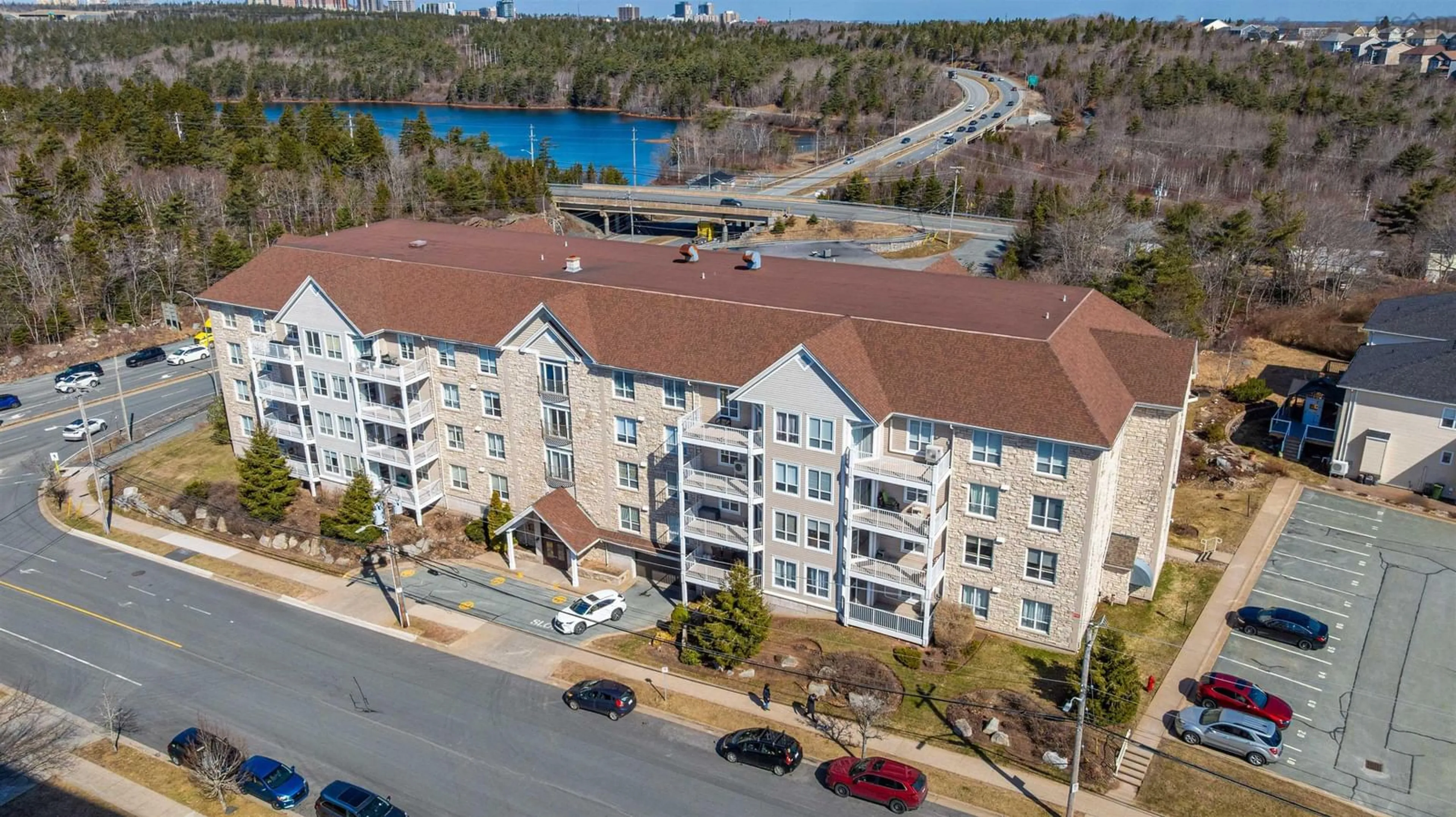 A pic from outside/outdoor area/front of a property/back of a property/a pic from drone, water/lake/river/ocean view for 201 Walter Havill Dr #209, Halifax Nova Scotia B3N 3J4