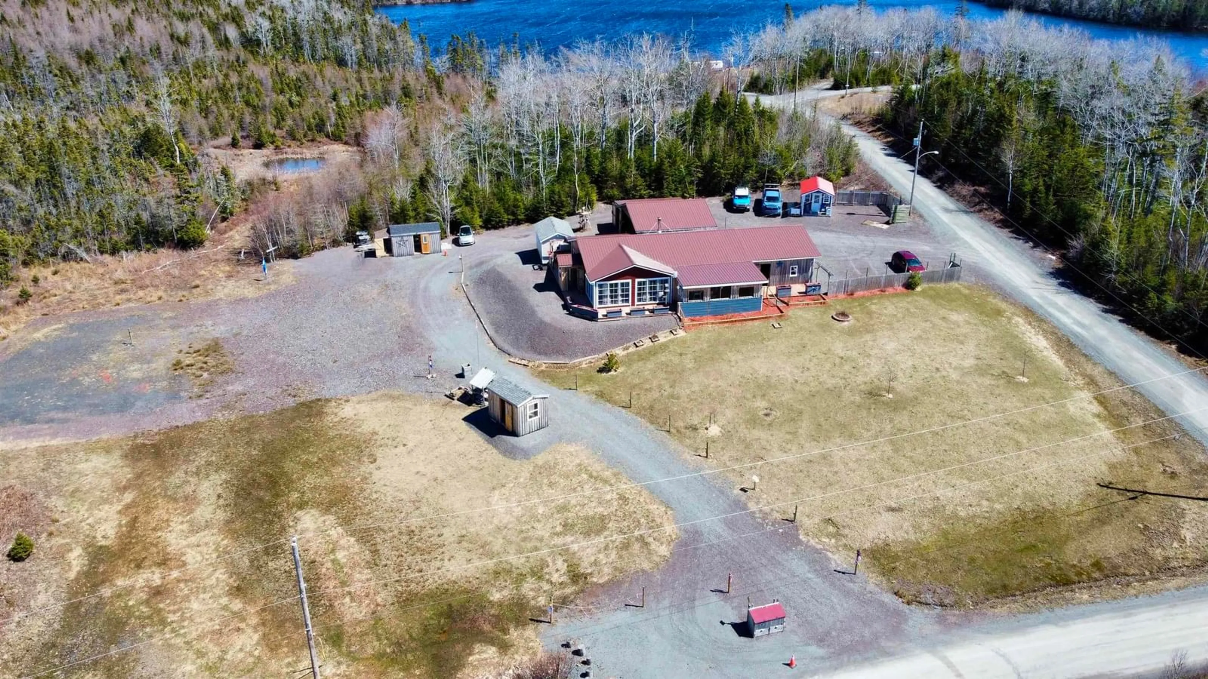 A pic from outside/outdoor area/front of a property/back of a property/a pic from drone, water/lake/river/ocean view for 7 Lances Lane, D'Escousse Nova Scotia B0E 1K0