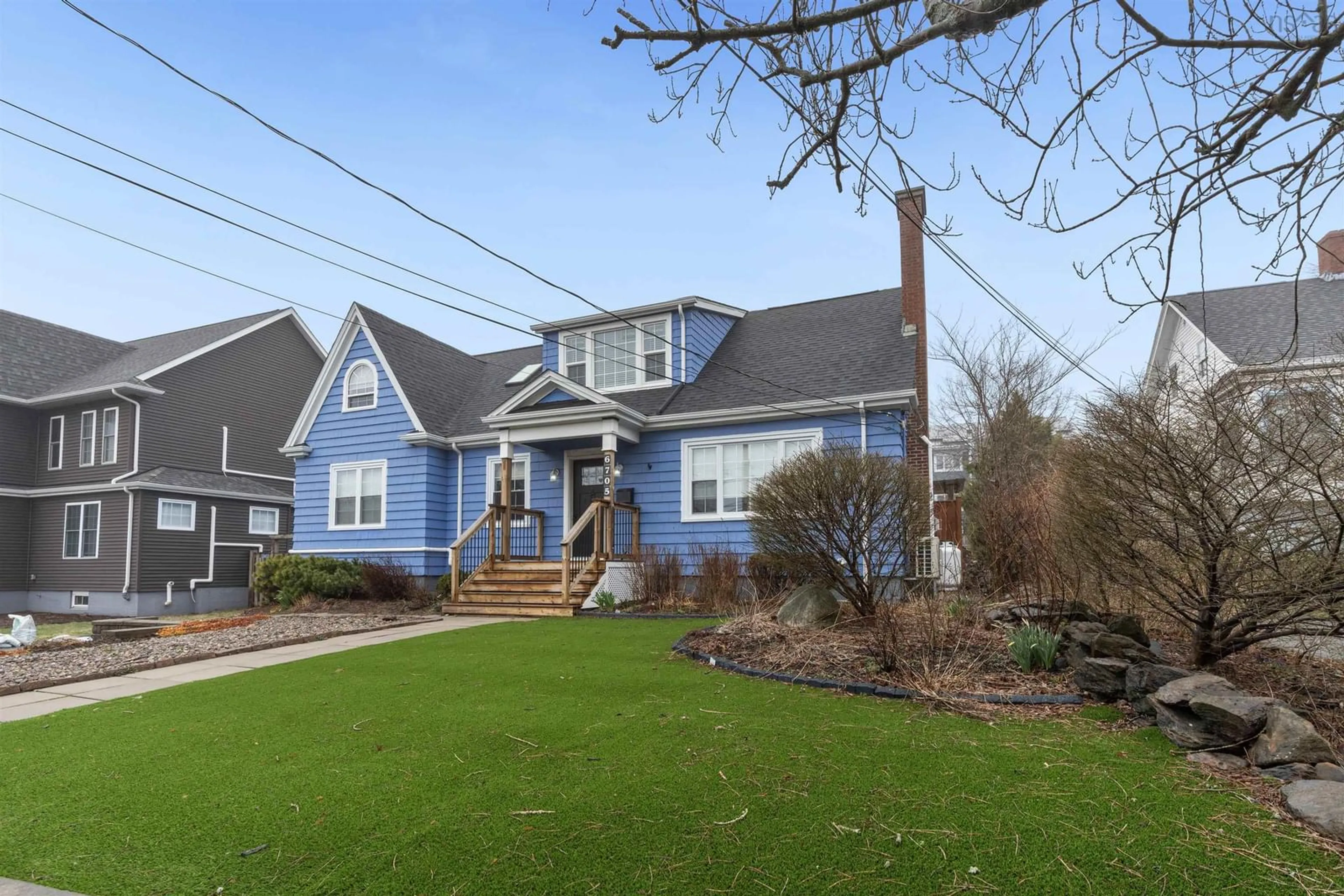 Home with vinyl exterior material, street for 6705 Quinpool Rd, Halifax Nova Scotia B3L 1C1