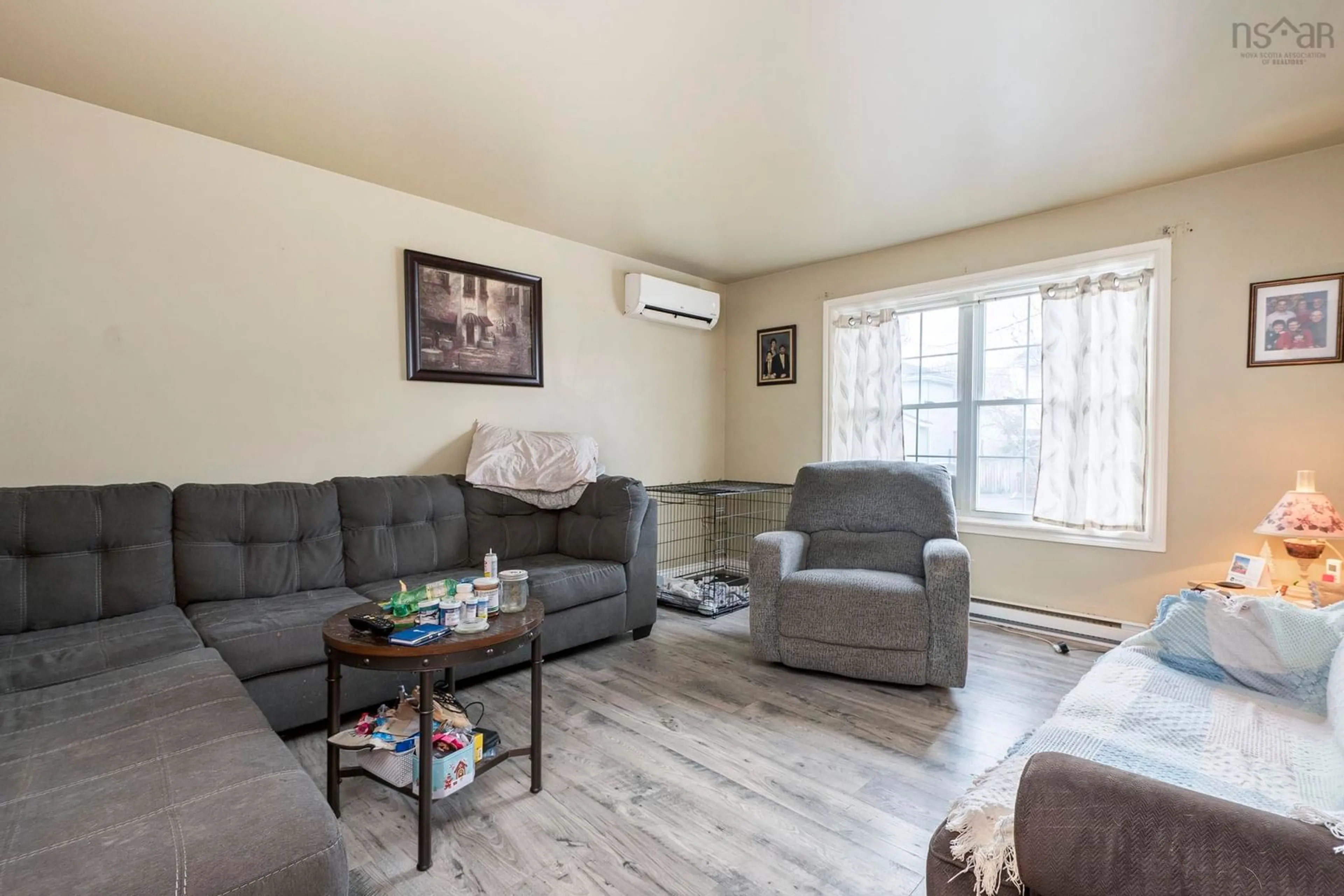 Living room with furniture, wood/laminate floor for 13 Mountain Maple Dr, Timberlea Nova Scotia B3T 1G7
