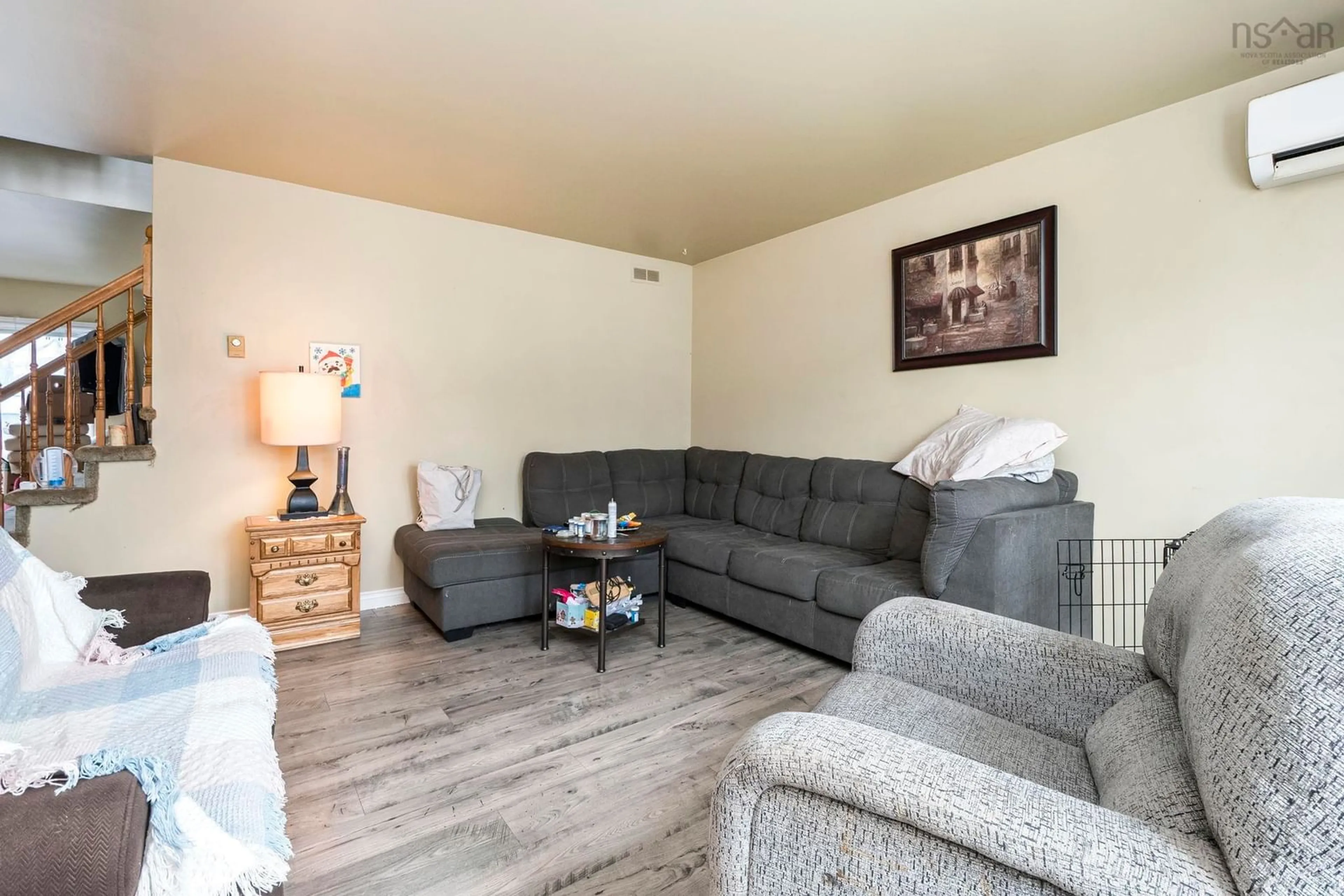 Living room with furniture, wood/laminate floor for 13 Mountain Maple Dr, Timberlea Nova Scotia B3T 1G7