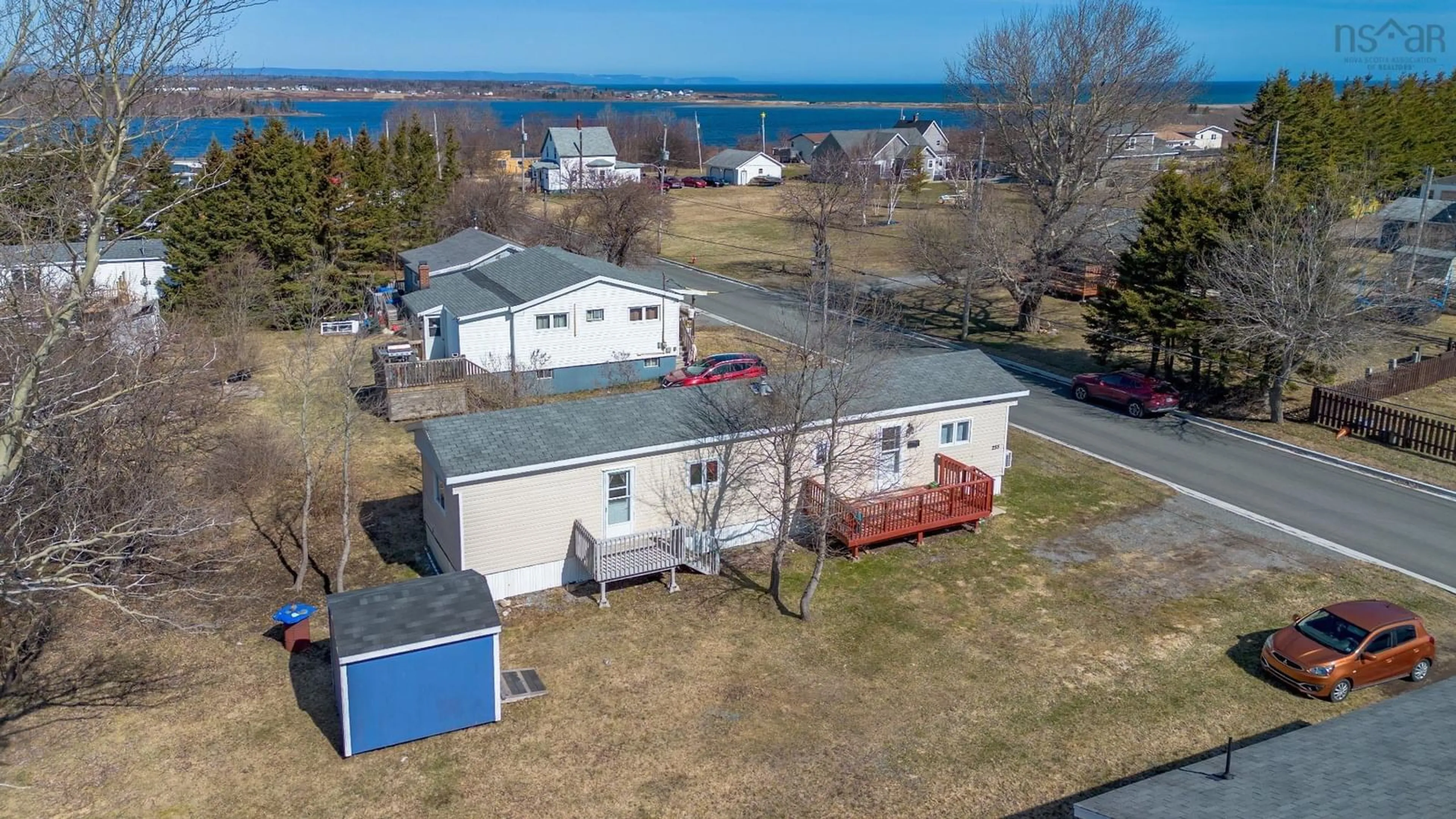 A pic from outside/outdoor area/front of a property/back of a property/a pic from drone, water/lake/river/ocean view for 255 Legatto St, Sydney Mines Nova Scotia B1V 2Z7