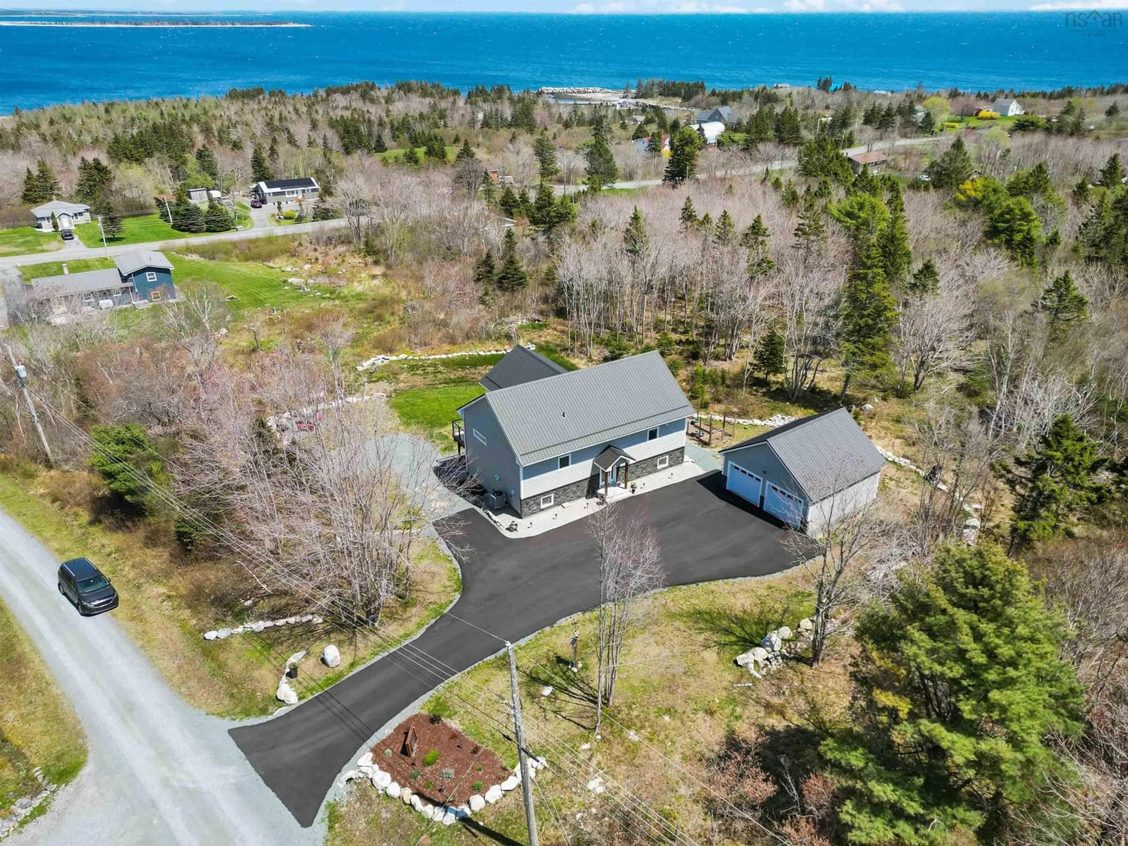 A pic from outside/outdoor area/front of a property/back of a property/a pic from drone, water/lake/river/ocean view for 31 Old Ice Rd, Moose Harbour Nova Scotia B0T 1K0