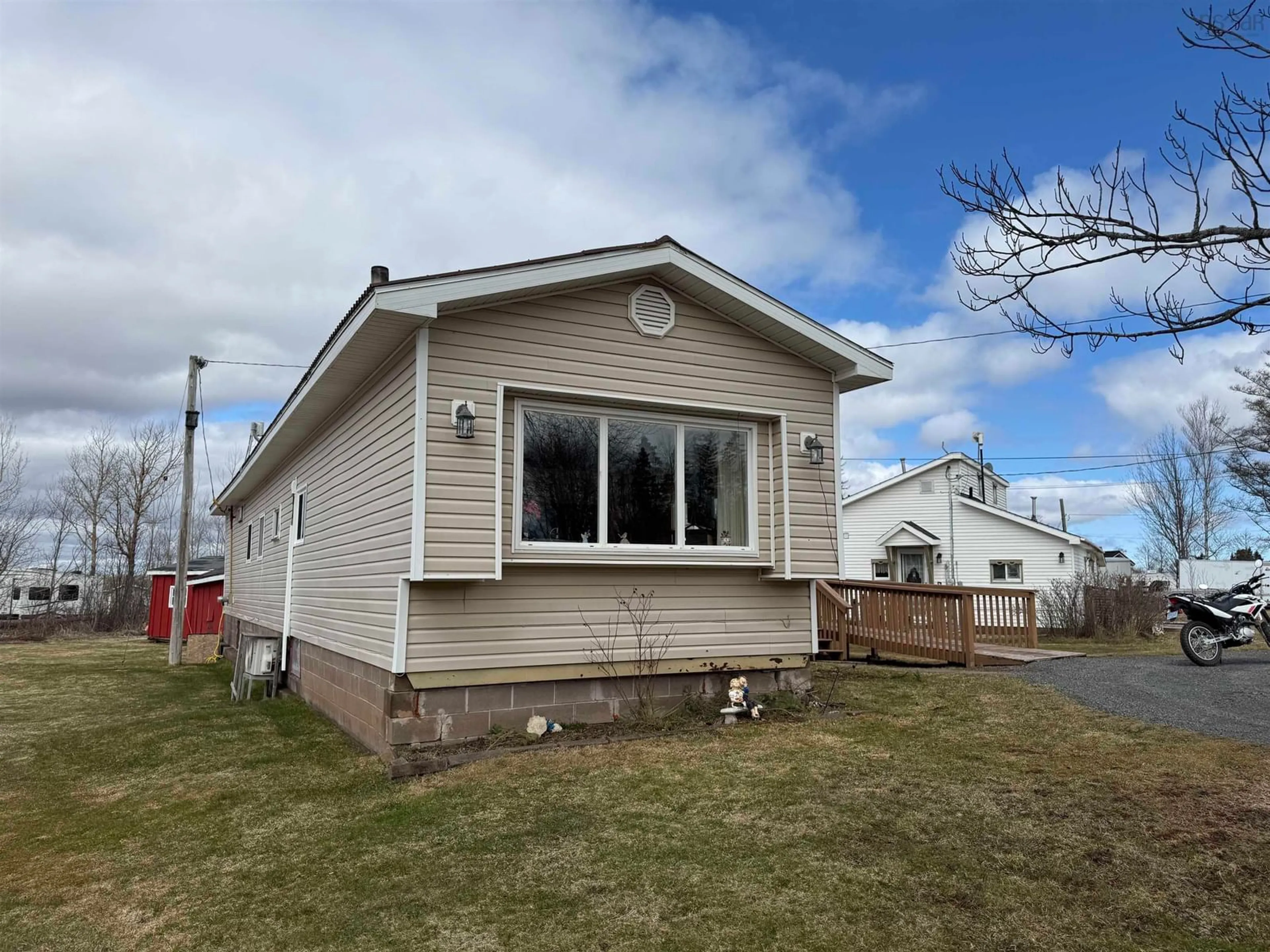 Home with vinyl exterior material, street for 21 Jackson Point Rd, Tidnish Bridge Nova Scotia B4H 3X9
