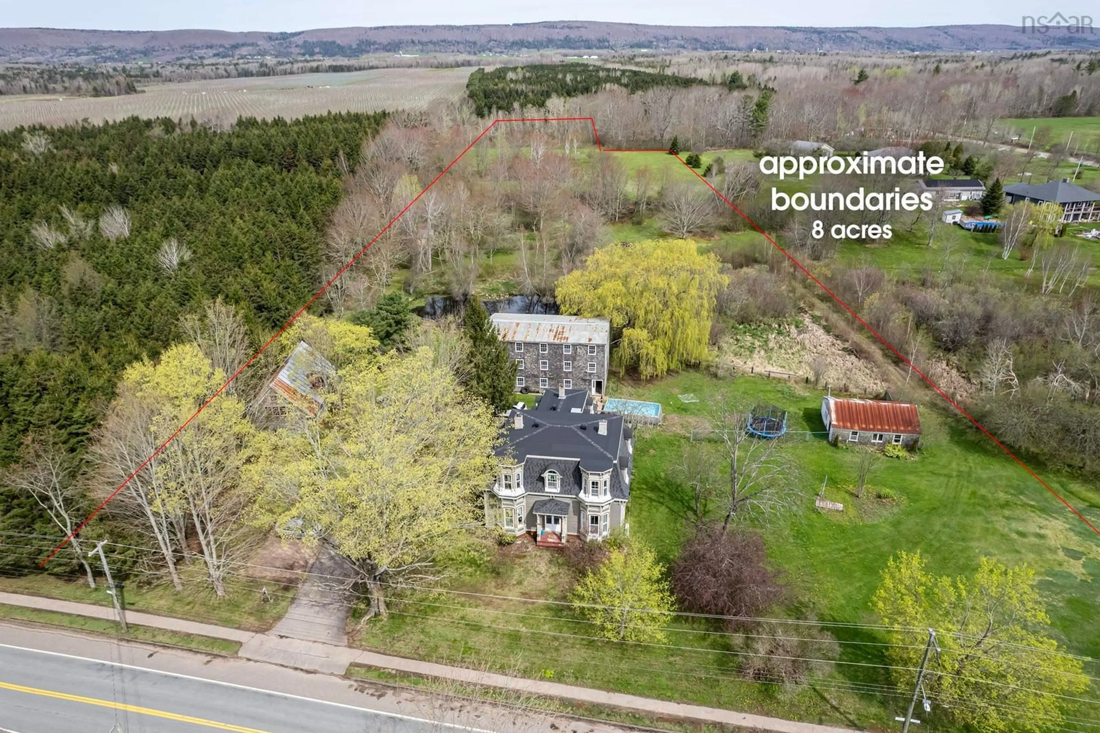 A pic from outside/outdoor area/front of a property/back of a property/a pic from drone, building for 10419 Highway 1, Paradise Nova Scotia B0S 1L0