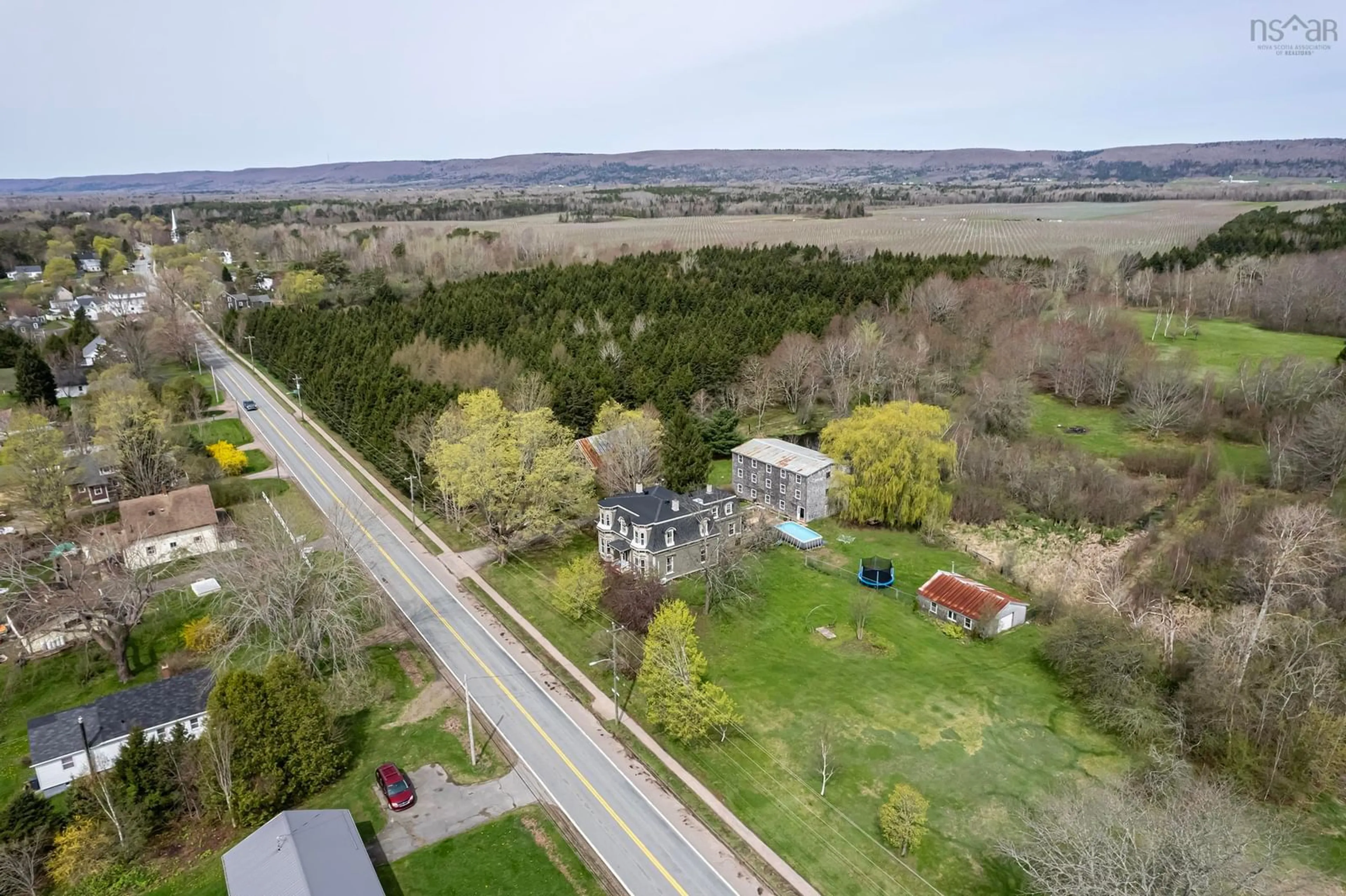 A pic from outside/outdoor area/front of a property/back of a property/a pic from drone, street for 10419 Highway 1, Paradise Nova Scotia B0S 1L0