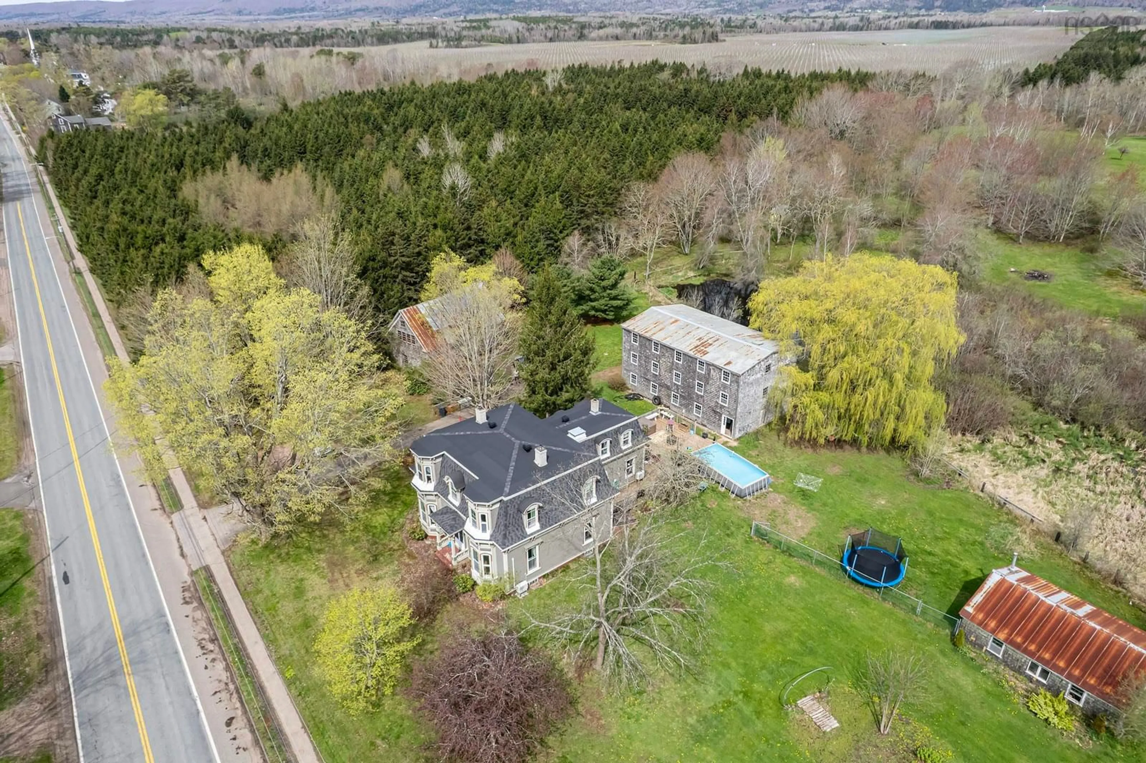 A pic from outside/outdoor area/front of a property/back of a property/a pic from drone, unknown for 10419 Highway 1, Paradise Nova Scotia B0S 1L0
