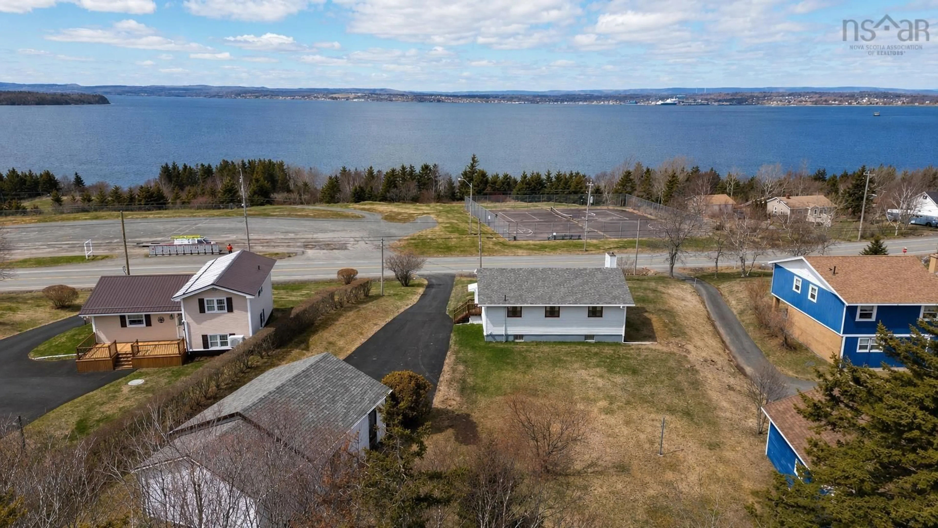 A pic from outside/outdoor area/front of a property/back of a property/a pic from drone, water/lake/river/ocean view for 2190 Highway 28, South Bar Nova Scotia B1N 3H7