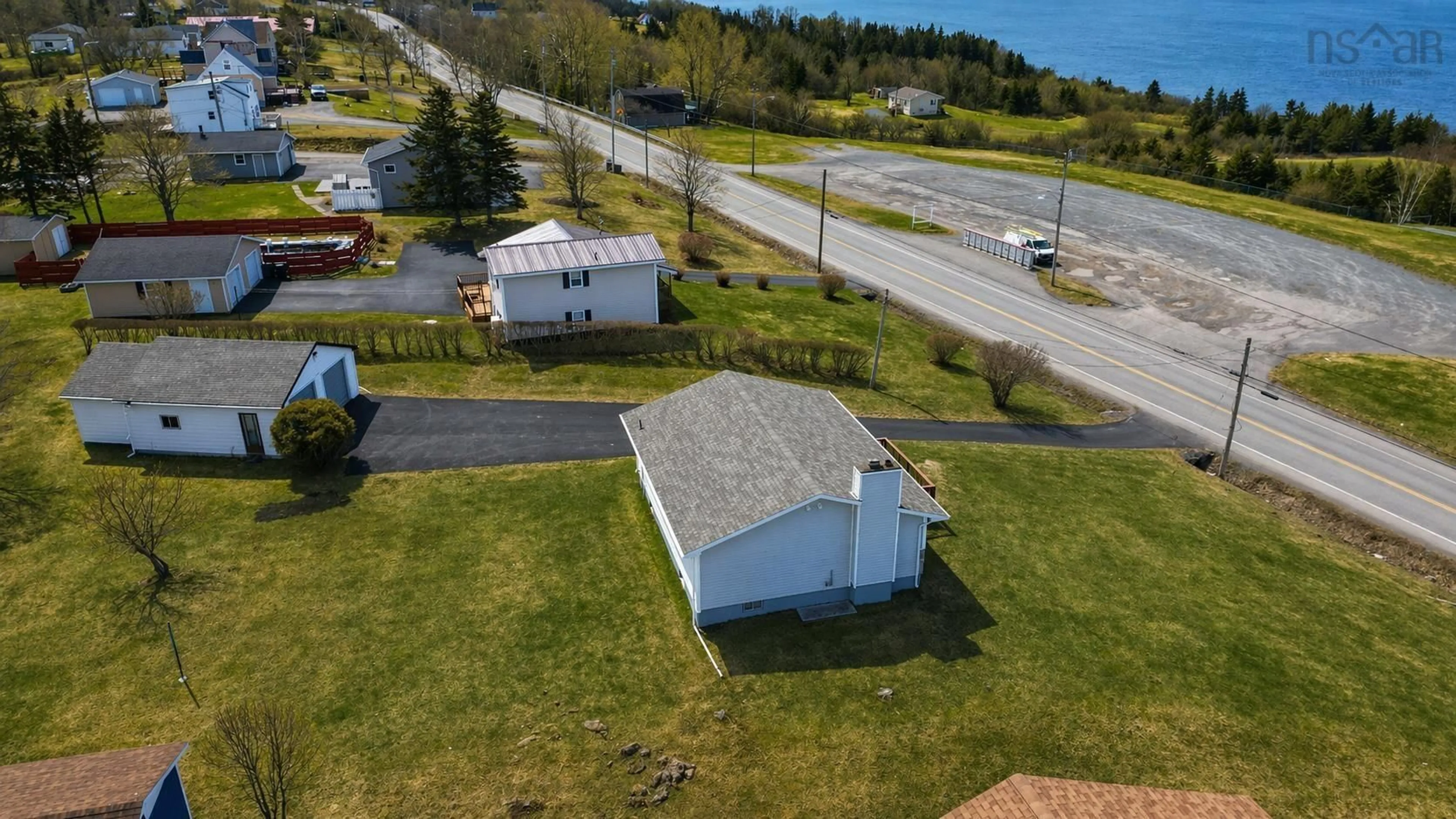 A pic from outside/outdoor area/front of a property/back of a property/a pic from drone, unknown for 2190 Highway 28, South Bar Nova Scotia B1N 3H7